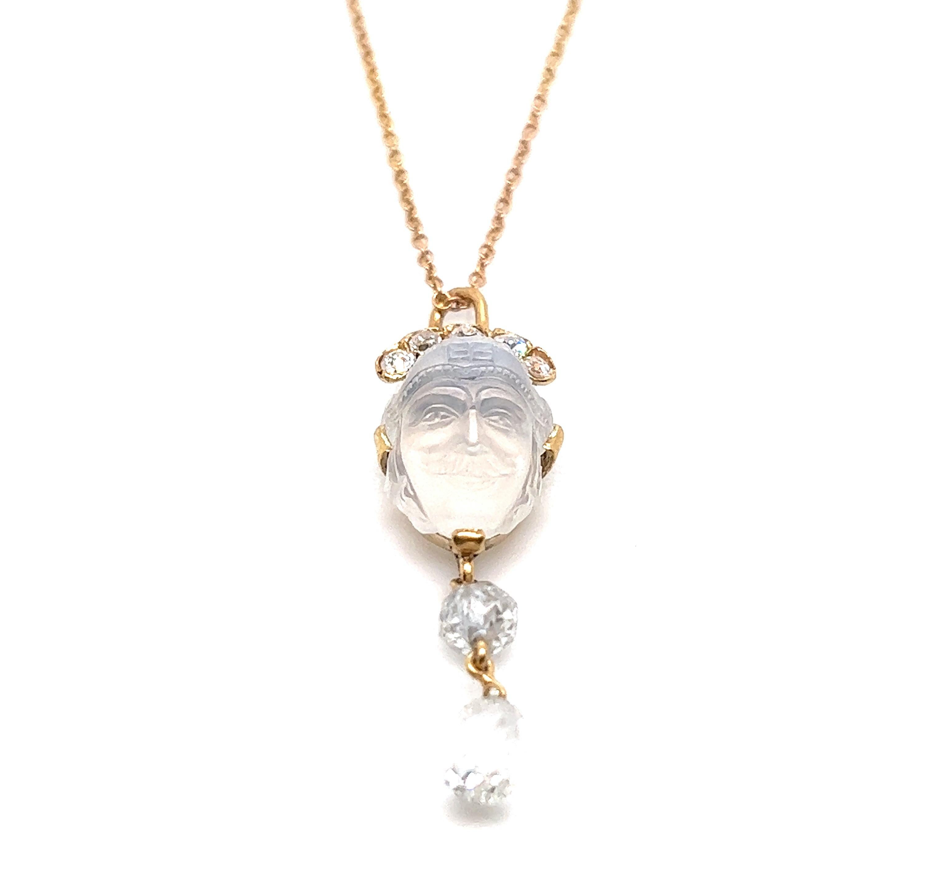 Tiffany & Co. antique moonstone and briolette pendant drop necklace

Carved moonstone of a man's face, round briolette of approximately 1.5 carat, five diamond stones of approximately 0.5 carat, 18 karat yellow gold

Marked: Tiffany & Co., 750