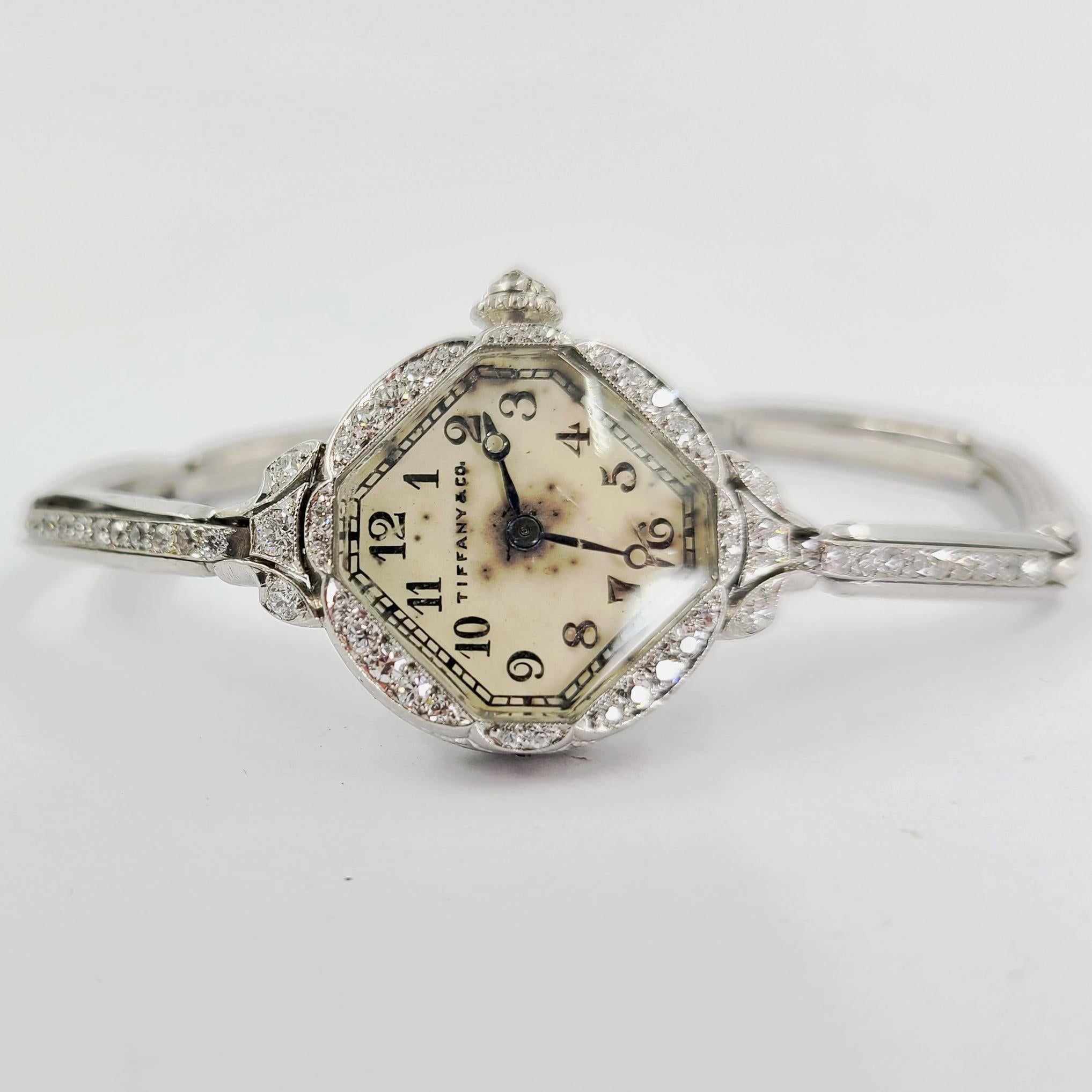 Antique Tiffany & Co Platinum Ladies Wristwatch Featuring A Working C.H. Meylan Manual Wind Movement. 50 Single Cut Diamonds of VS Clarity & G/H Color Total Approximately 0.50 Carat. Six Inch Length. Finished Weight Is 24.7 Grams. Discolored Dial.
