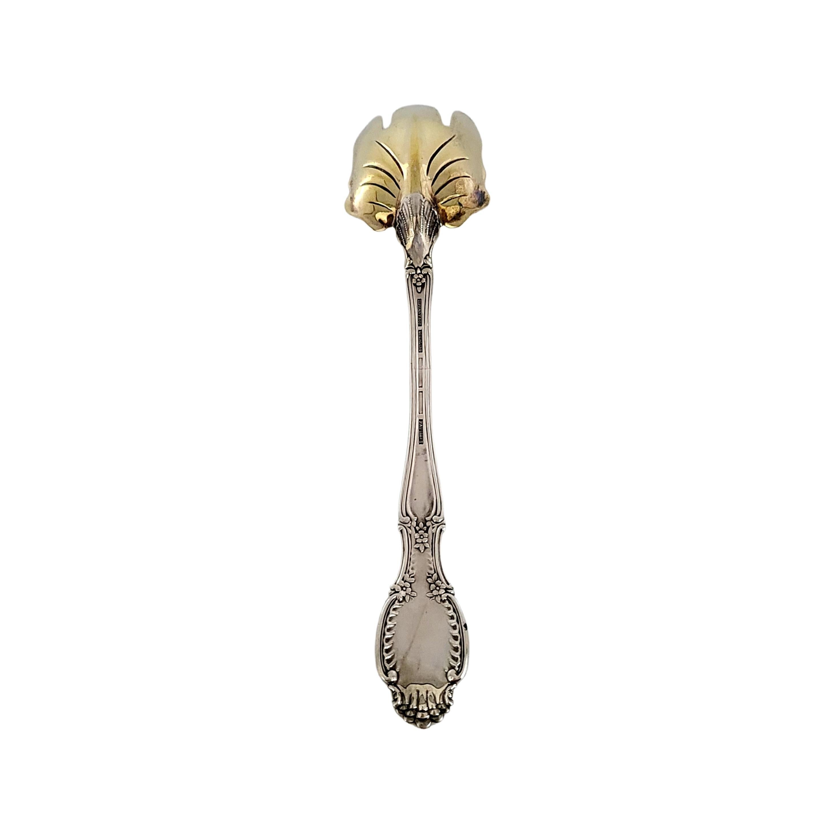 Antique Tiffany & Co sterling silver with gold wash bowl salad serving fork in the Richelieu pattern.

The Richelieu pattern was designed in 1892 by Paulding Farnham, Tiffany's chief designer of the time. This piece features a 3 tined gold washed