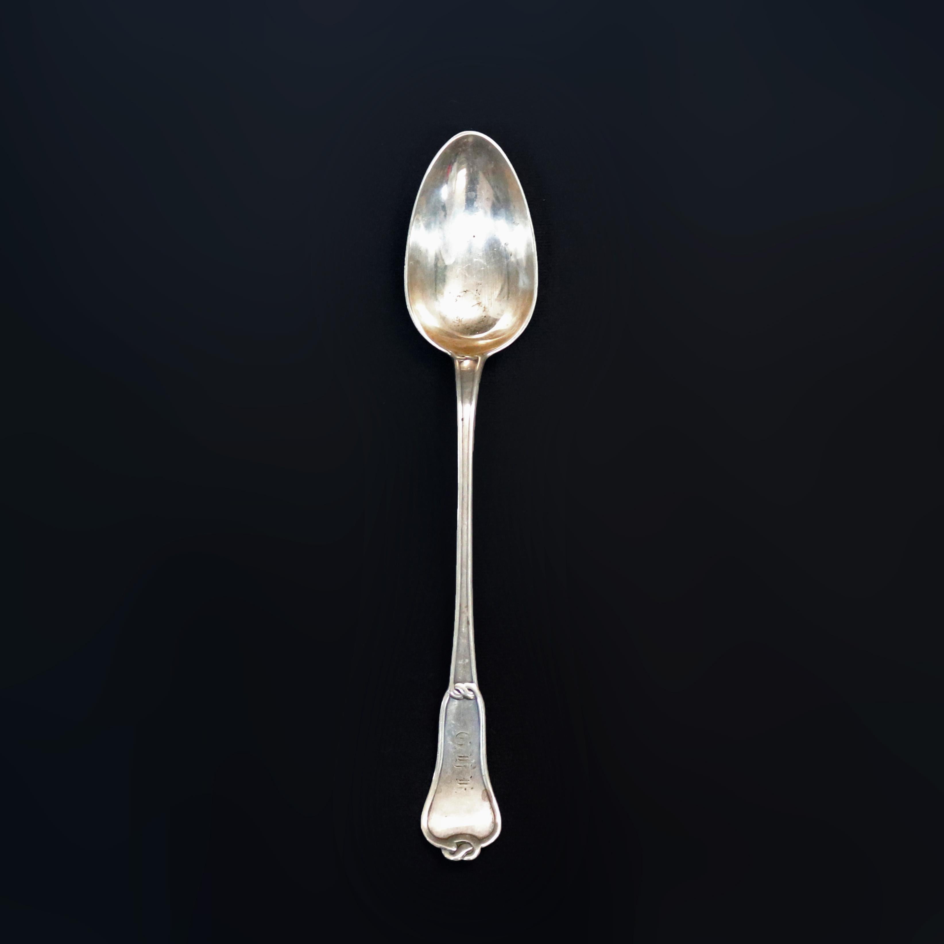 An antique sterling silver basting spoon by Tiffany & Co. offers rope or pretzel twist handle with monogram and maker stamp as photographed, circa 1901

Measures; 12.5