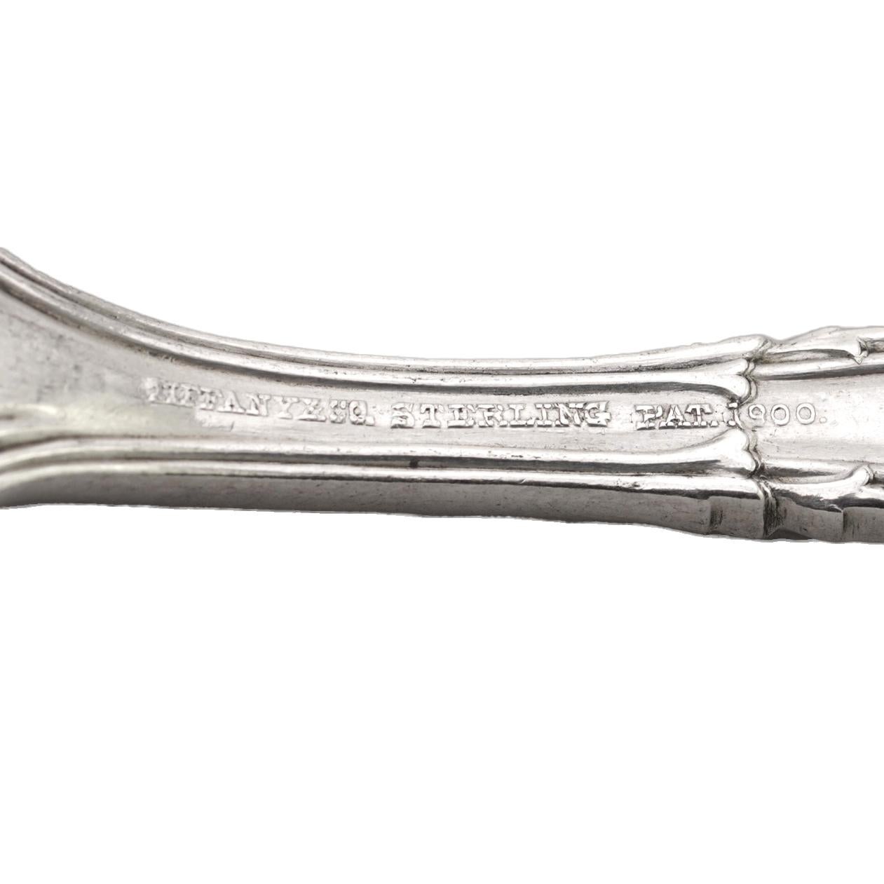 Antique Tiffany & Co. sterling silver Florentine pattern salt spoon.

Maker: Tiffany & Co
Pattern: Designed by Paulding Farnham
Style: Renaissance Revival
Introduced 1900, but the patent application not filed until May 9, 1904, issued June 7,