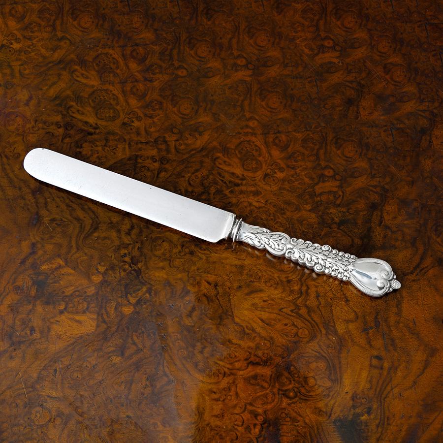 Antique Tiffany & Co. sterling silver Florentine pattern knife. 

Maker: Tiffany & Co
Pattern: Designed by Paulding Farnham
Style: Renaissance Revival
Introduced 1900, but the patent application not filed until May 9, 1904, issued June 7,