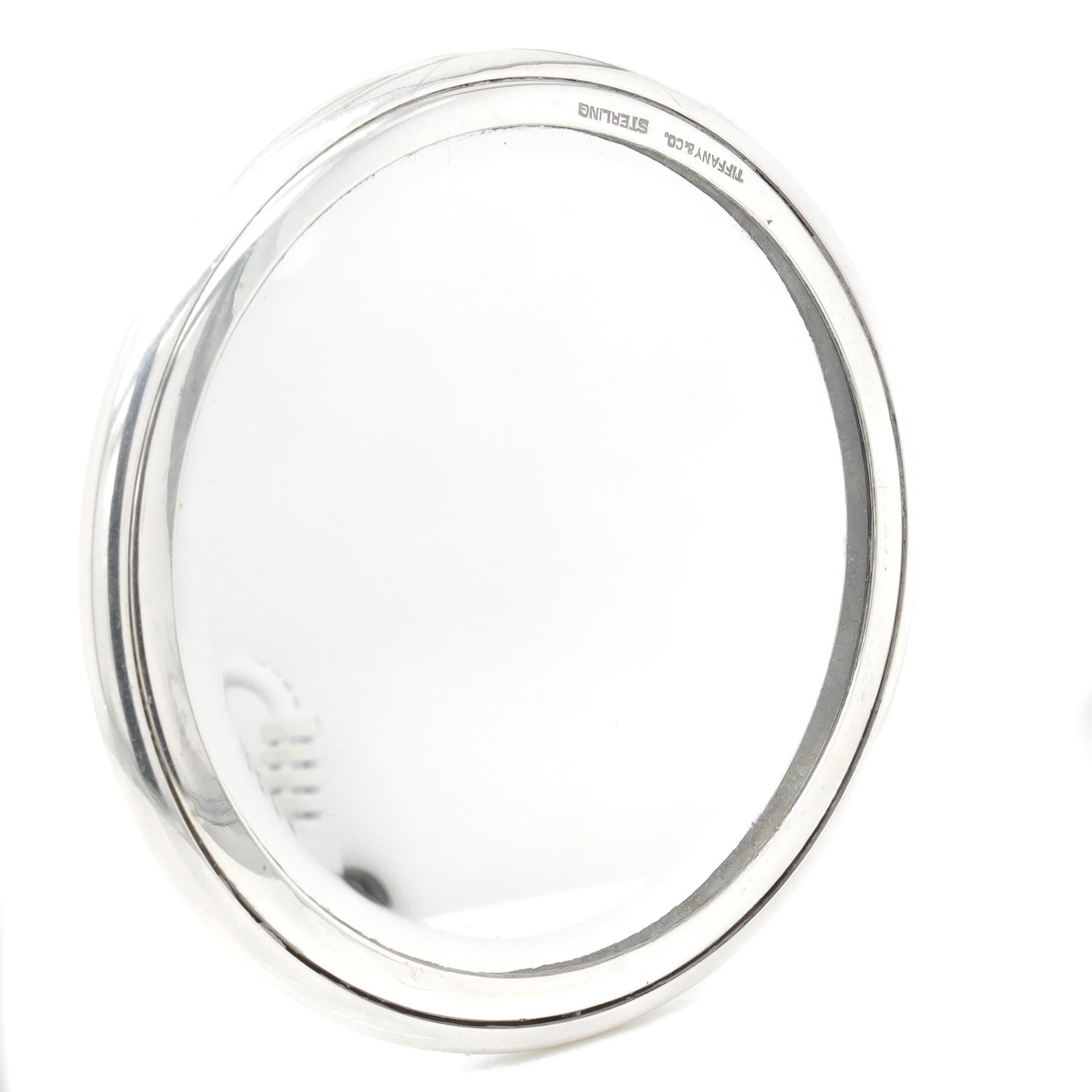 A fine antique silver hand mirror.

In sterling silver.

By Tiffany & Co.

Marked to the rim for Tiffany & Co. / Sterling.

Simply a wonderful Tiffany design!

Date: 
20th Century

Overall Condition:
It is in overall good, as-pictured, used estate