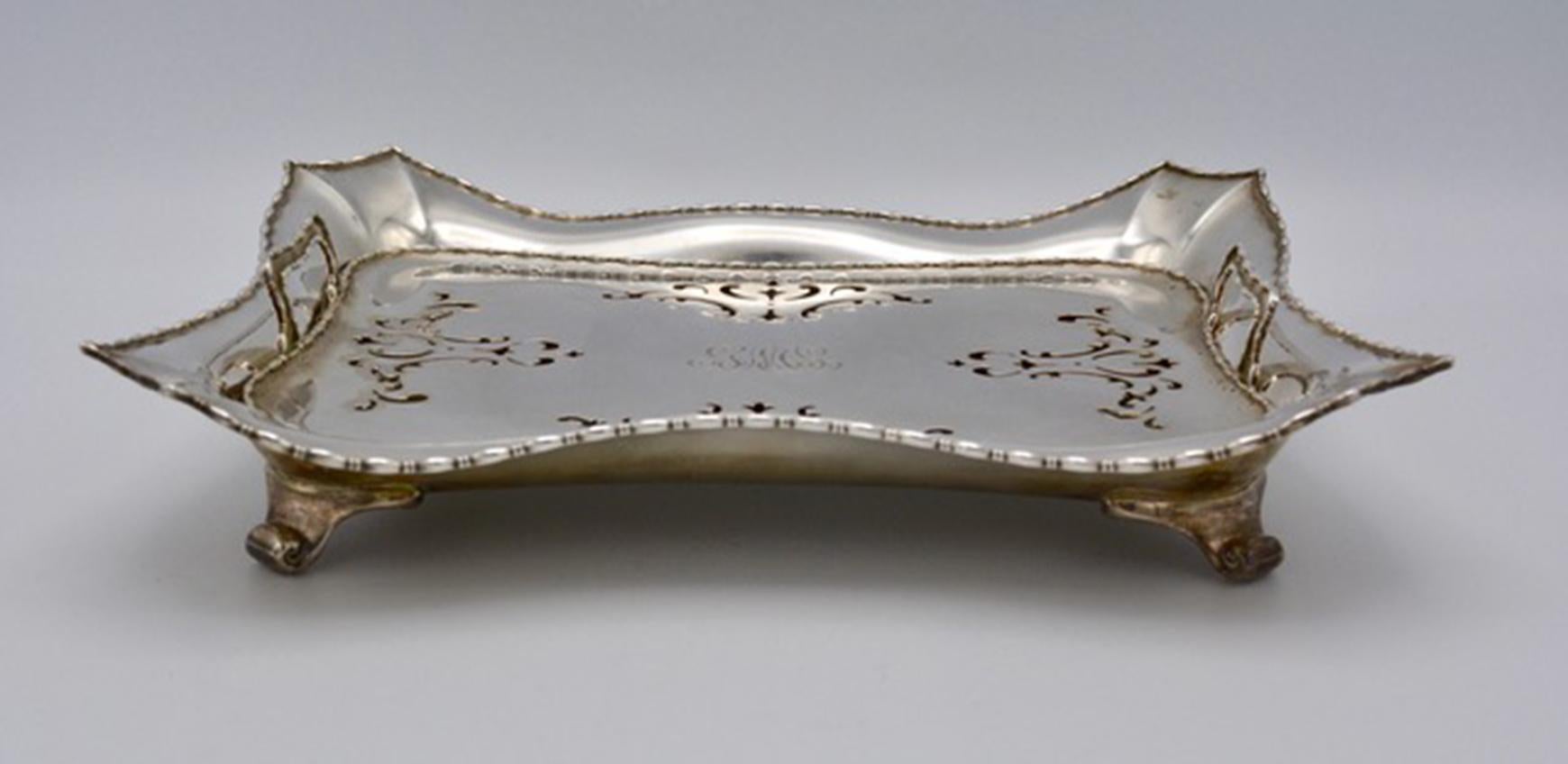 Tiffany & Co. sterling silver marquise asparagus server with pierced Insert. Scalloped rectangular form. Approximate size: 12