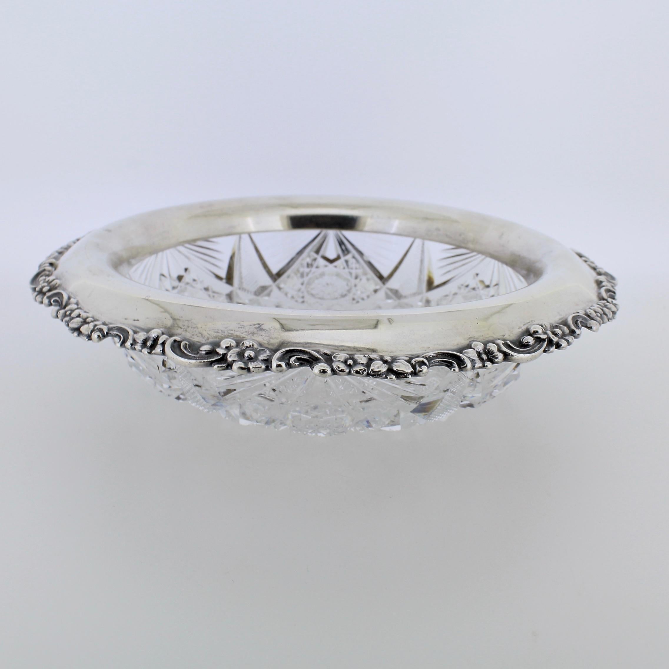 A very fine, antique Tiffany & Co. cut glass and sterling silver bowl.

With a fine and deep cut to an American Brilliant Period glass bowl that is mounted with an ornate Tiffany & Co. sterling silver collar.

The collar has an everted rim, a floral