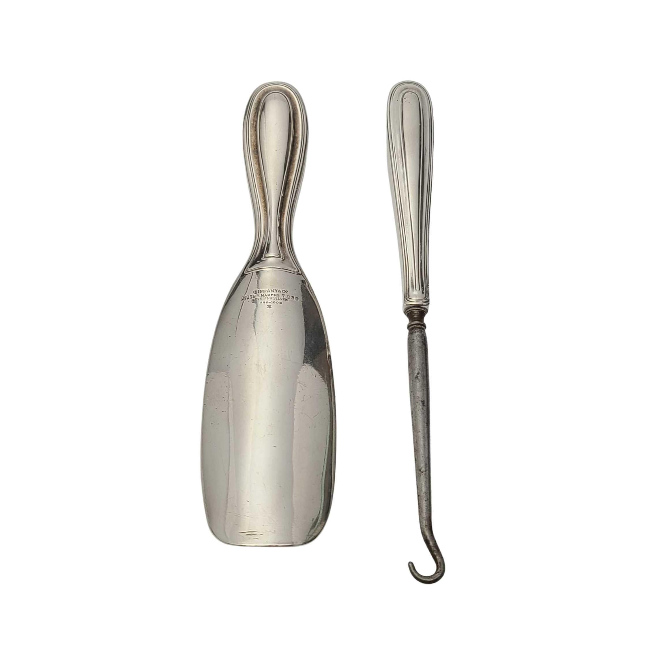 Antique sterling silver show horn and button hook by Tiffany & Co, circa 1908-1909.

Monogram appears to be HBY

Simple and timeless thick handle design. Same monogram on each piece, but engraved in different styles. Hallmarks date these pieces