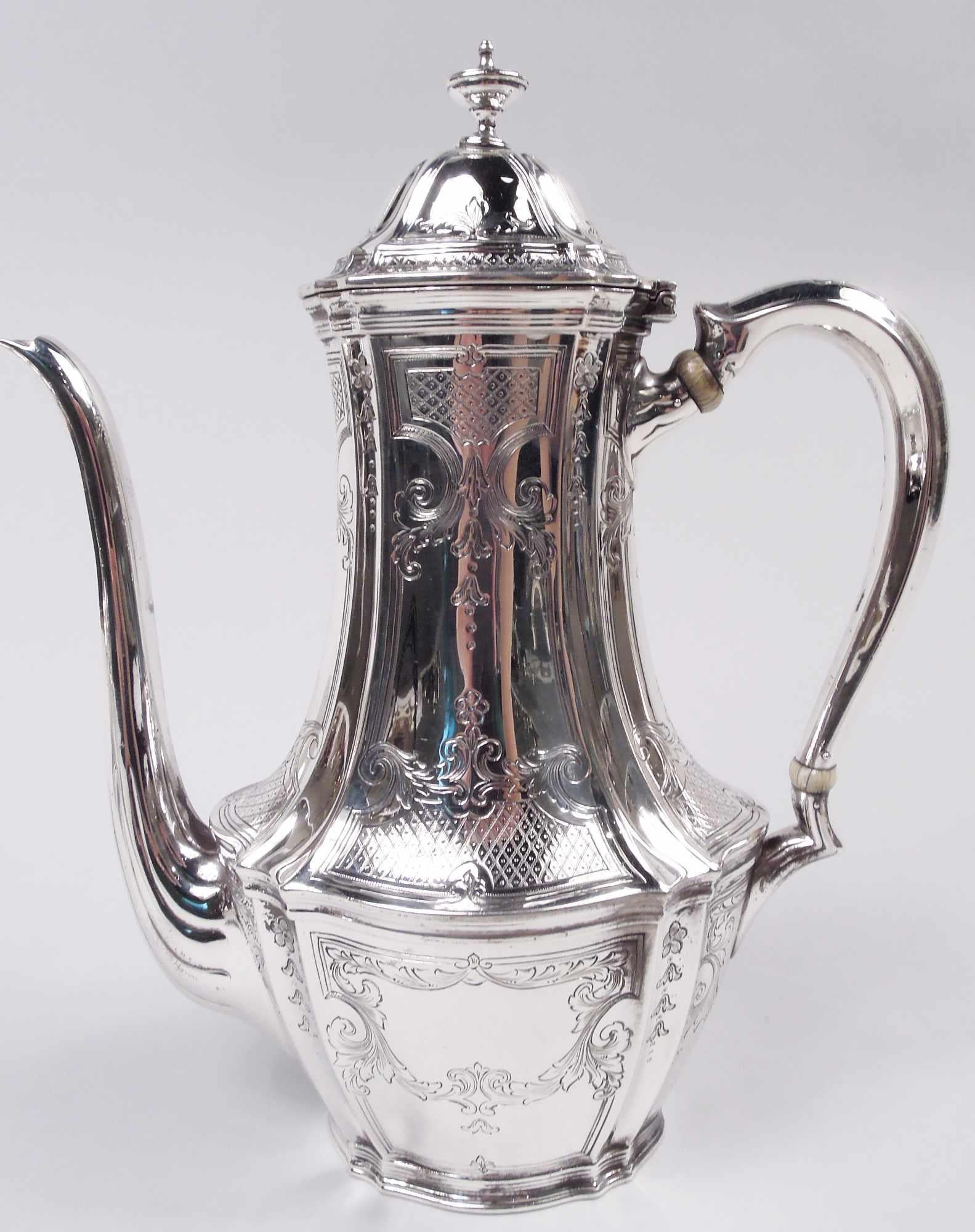 Edwardian Classical sterling silver coffee set on tray. Made by Tiffany & Co. in New York, ca 1921. This set comprises coffeepot, creamer, and sugar on tray. Each: Fluted ovoid body on same foot. Covered domed with vasiform finial. Handles capped