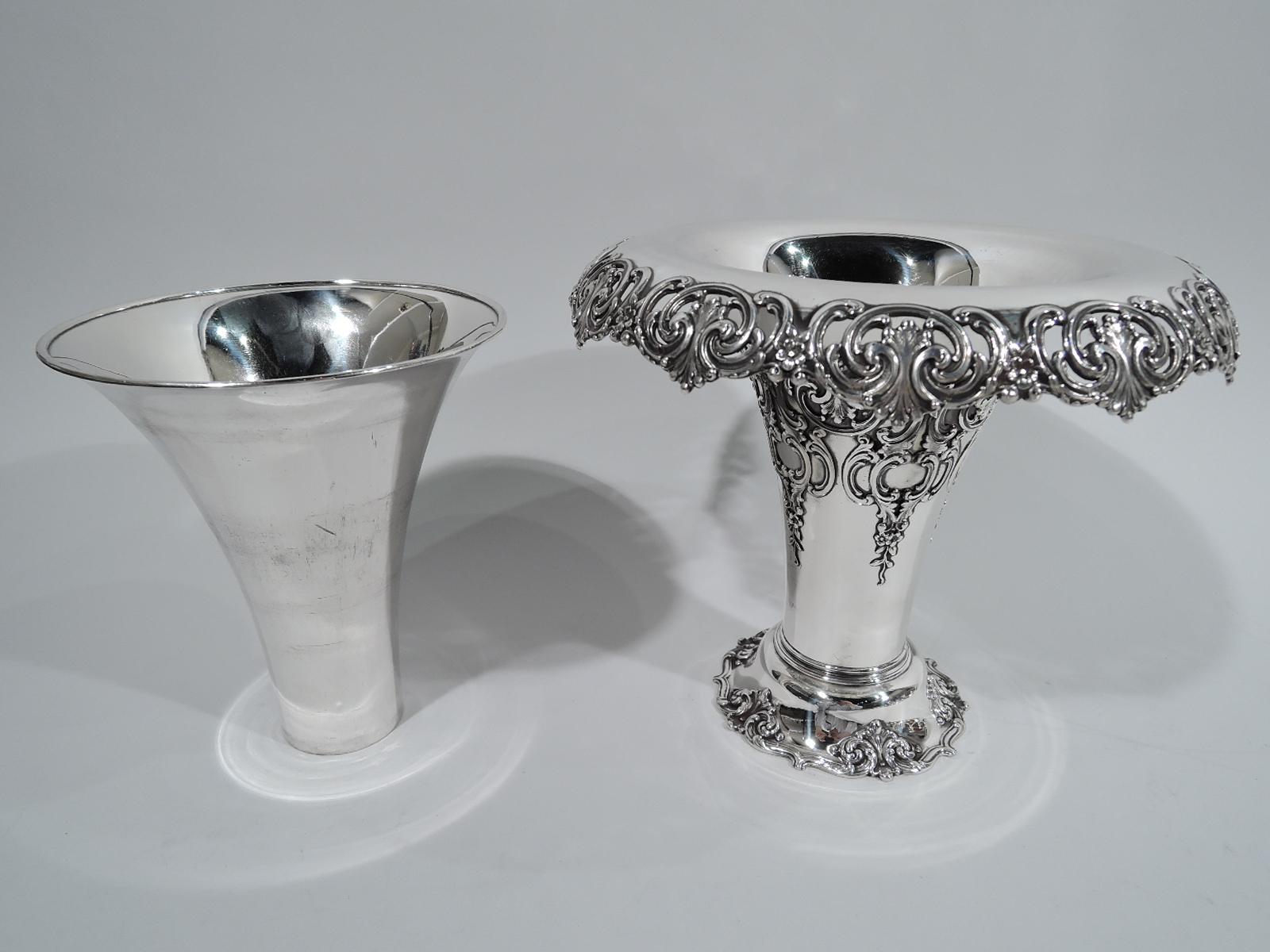 Edwardian classical sterling silver vase. Made by Tiffany & Co. in New York. Conical on raised and spread foot. Pierced and turned-down rim with scrolls, leaves, and flowers. Body applied with same and foot has ogee rim interspersed with leaves.