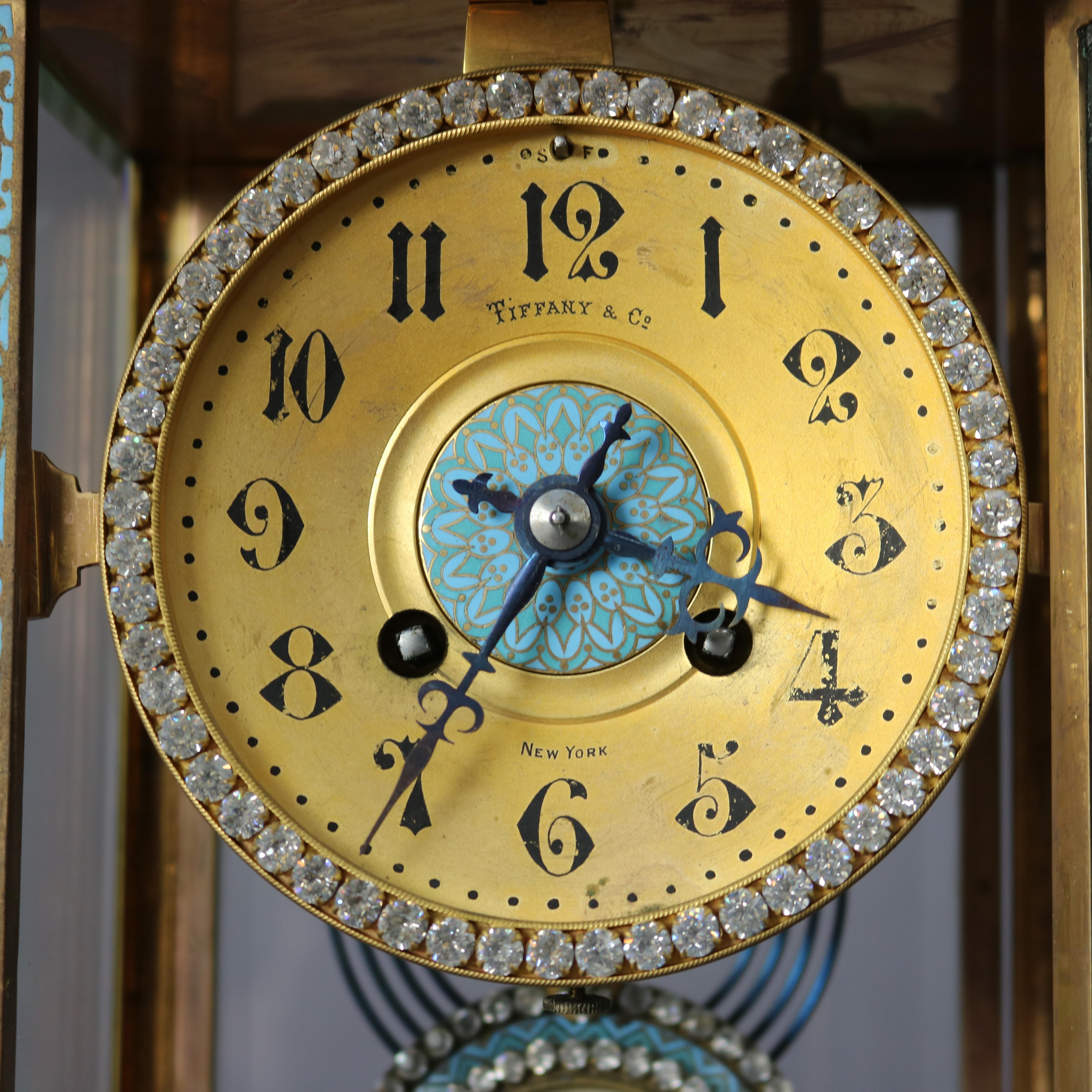 An antique crystal regulator clock by Tiffany offers enameled bow-front frame with rhinestone accents and portrait pendulum, maker mark as photographed, c1900

Measures - 11.75