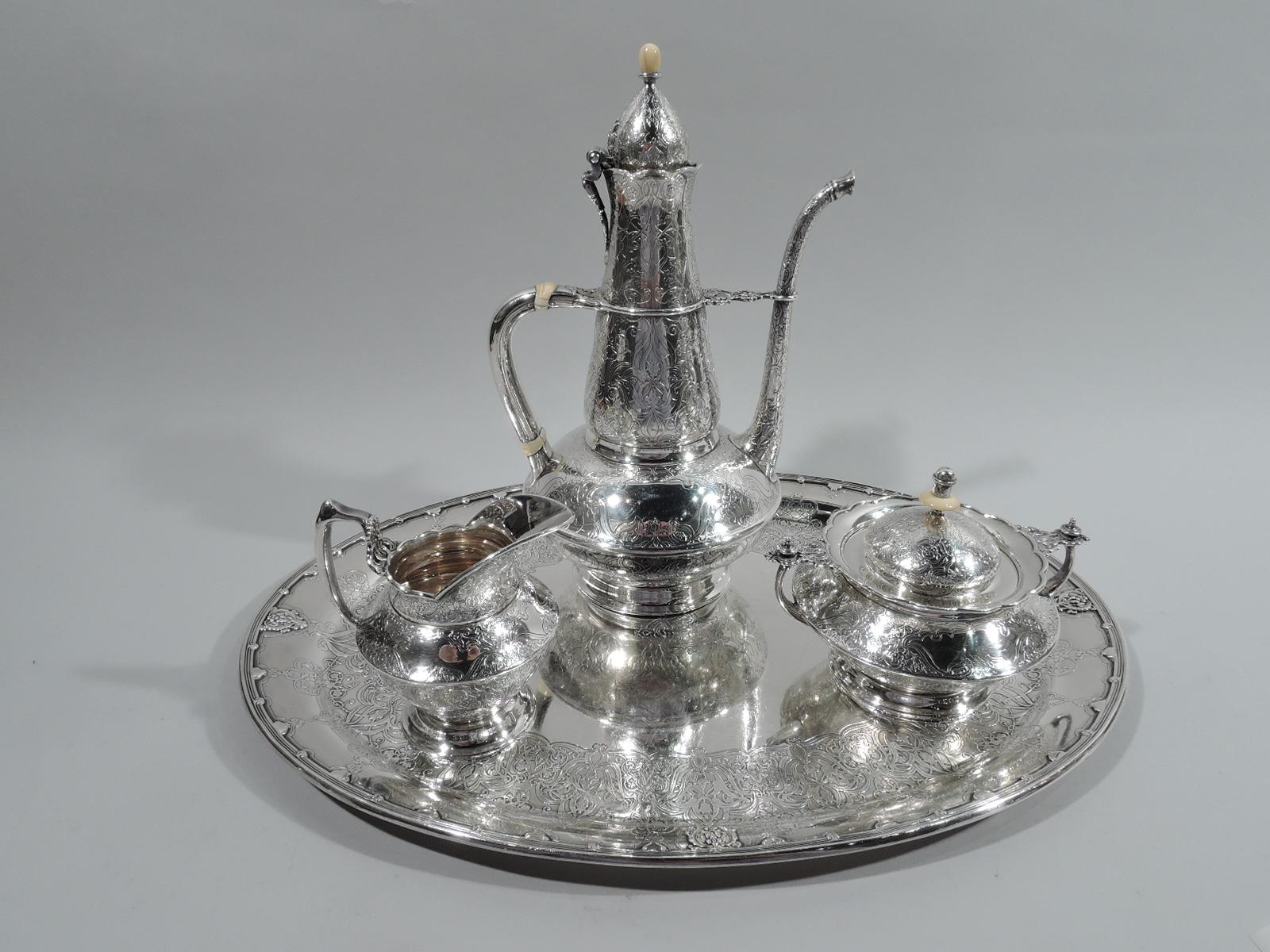 Persian sterling silver coffee set. Made by Tiffany & Co. in New York, ca 1910. This set comprises coffeepot, creamer, and sugar on tray.

Coffeepot: Bellied bowl with irregular conical neck with scalloped rim, hinged and domed cover, scrolled