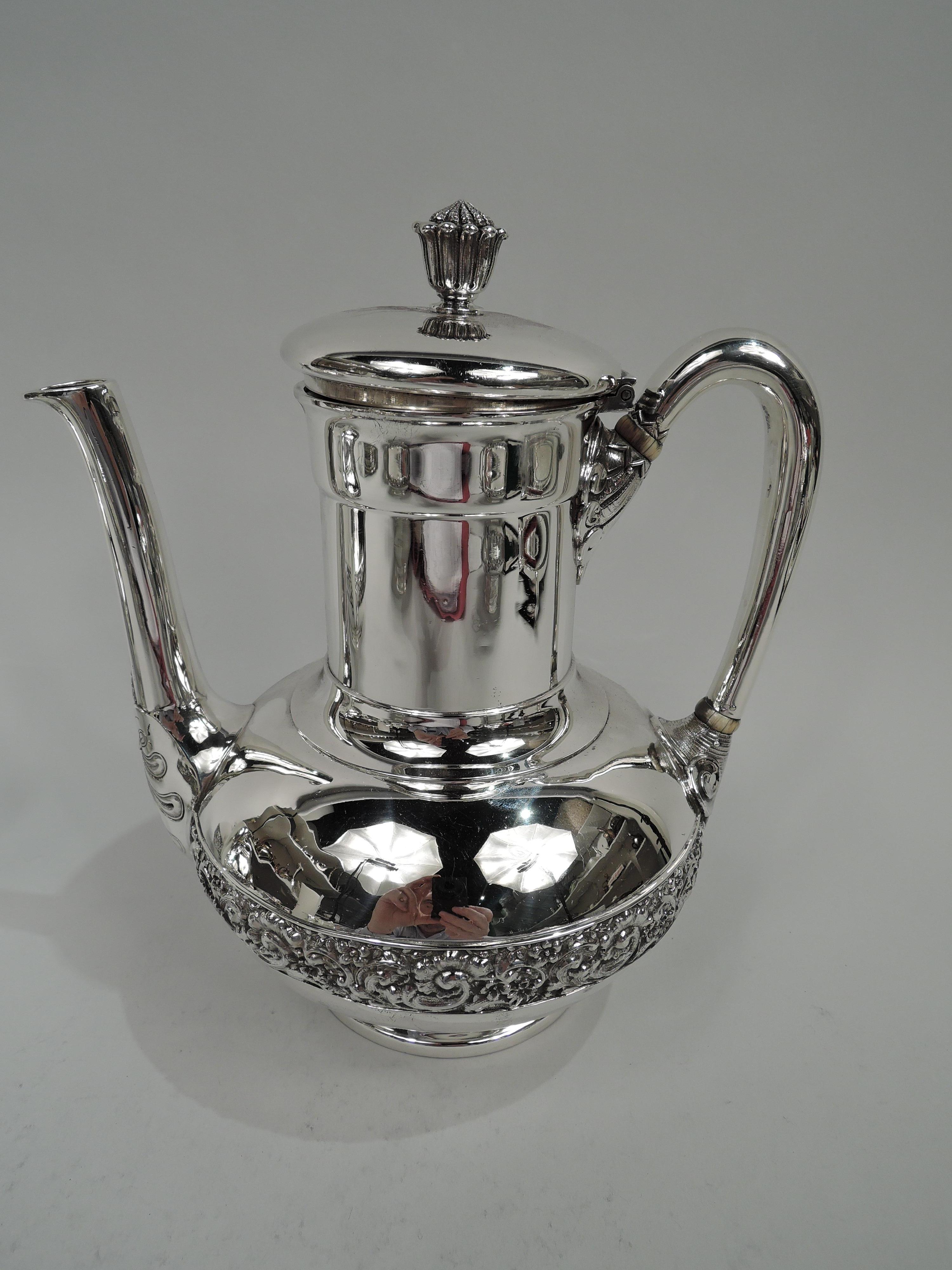 Victorian Classical sterling silver coffee and tea set. Made by Tiffany & Co. in New York. This set comprises coffeepot, teapot, creamer, sugar, and waste bowl.

Each: Bellied bowl on concave foot ring. Covers raised with cast bud finial (pot covers