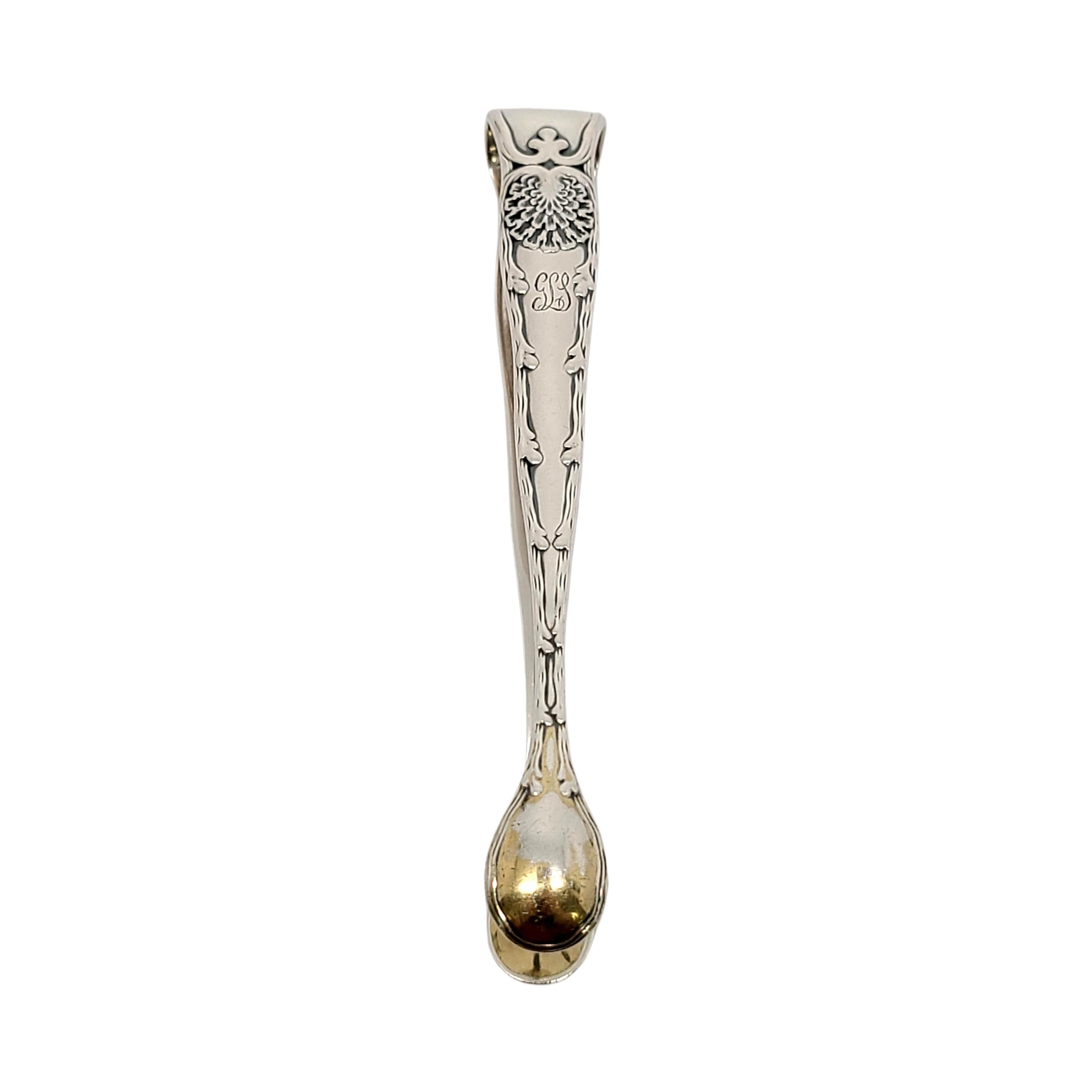 Sterling silver sugar tongs with gold washed shell tips by Tiffany & Co in the Wave Edge pattern.

Monogram appears to be GLS

The Wave Edge pattern is a marine motif designed by Charles T. Grosjean. This piece features small shell gold washed tips.