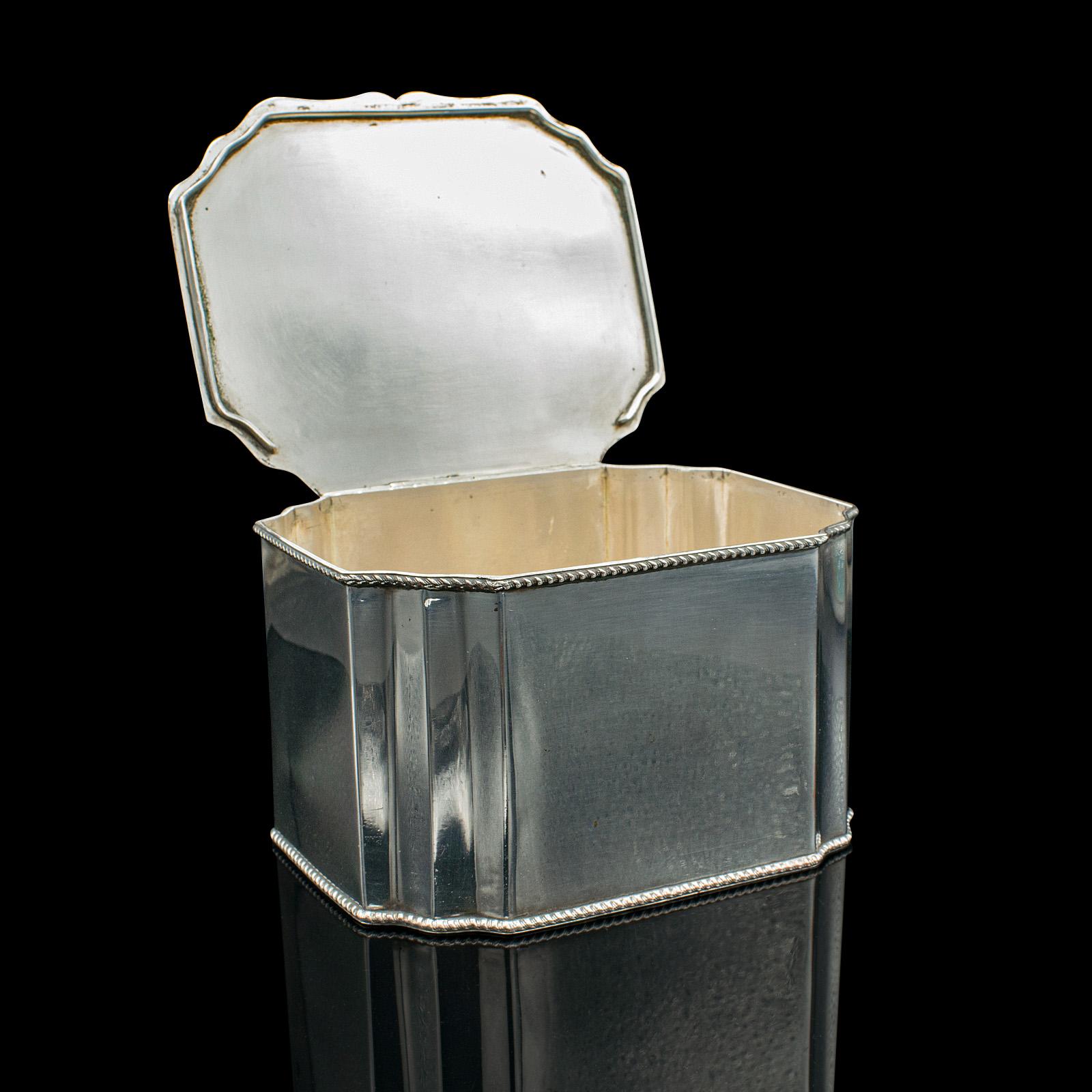 This is an antique tiffin box. An English, silver plated tea caddy, dating to the Edwardian period, circa 1910.

Appealing Edwardian box or caddy with a bright appearance
Displays a desirable aged patina and in good order
Silver plating presents