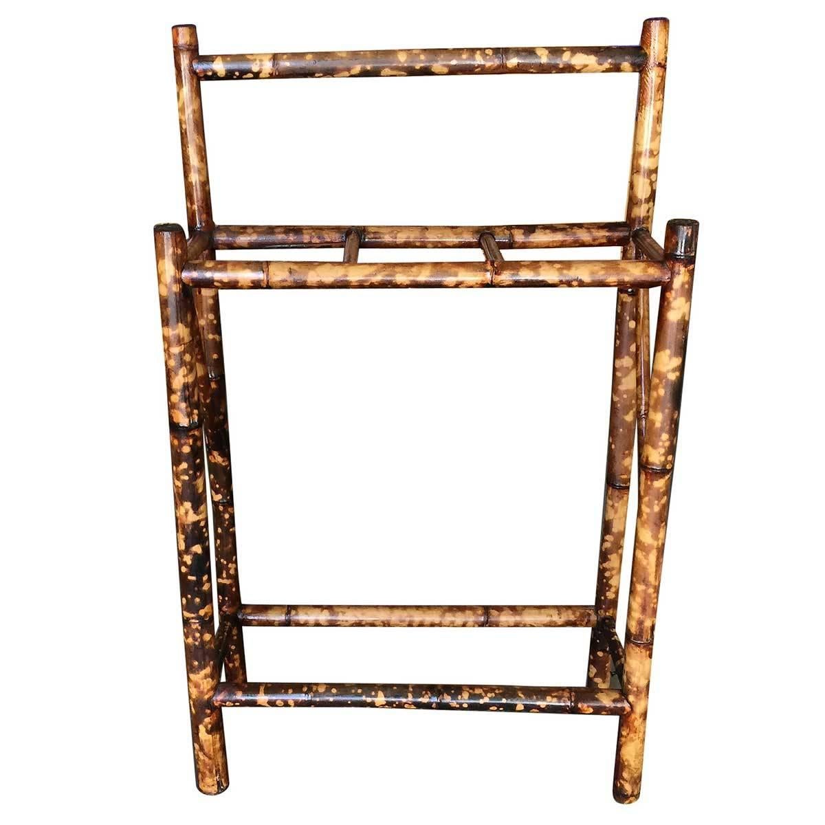 Antique tiger bamboo umbrella stand with back rail. The umbrella stand features three slots for storing umbrellas and canes.

Restored to new for you.

All rattan, bamboo and wicker furniture has been painstakingly refurbished to the highest