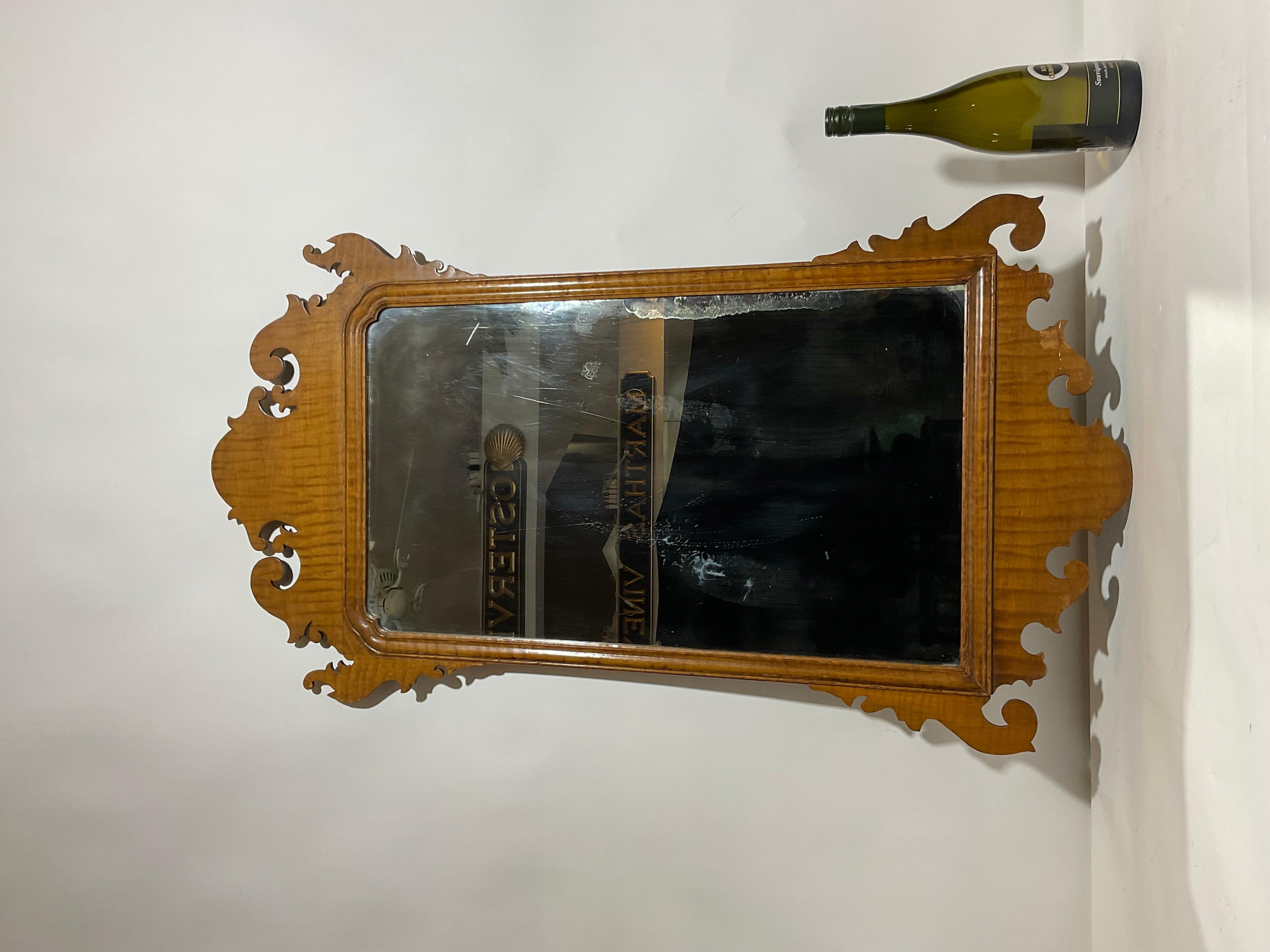 Antique tiger maple mirror. Very decorative but not perfect. Some veneer loss, some staining to mirror.

Weight: 8 lbs
Overall Dimensions: 42