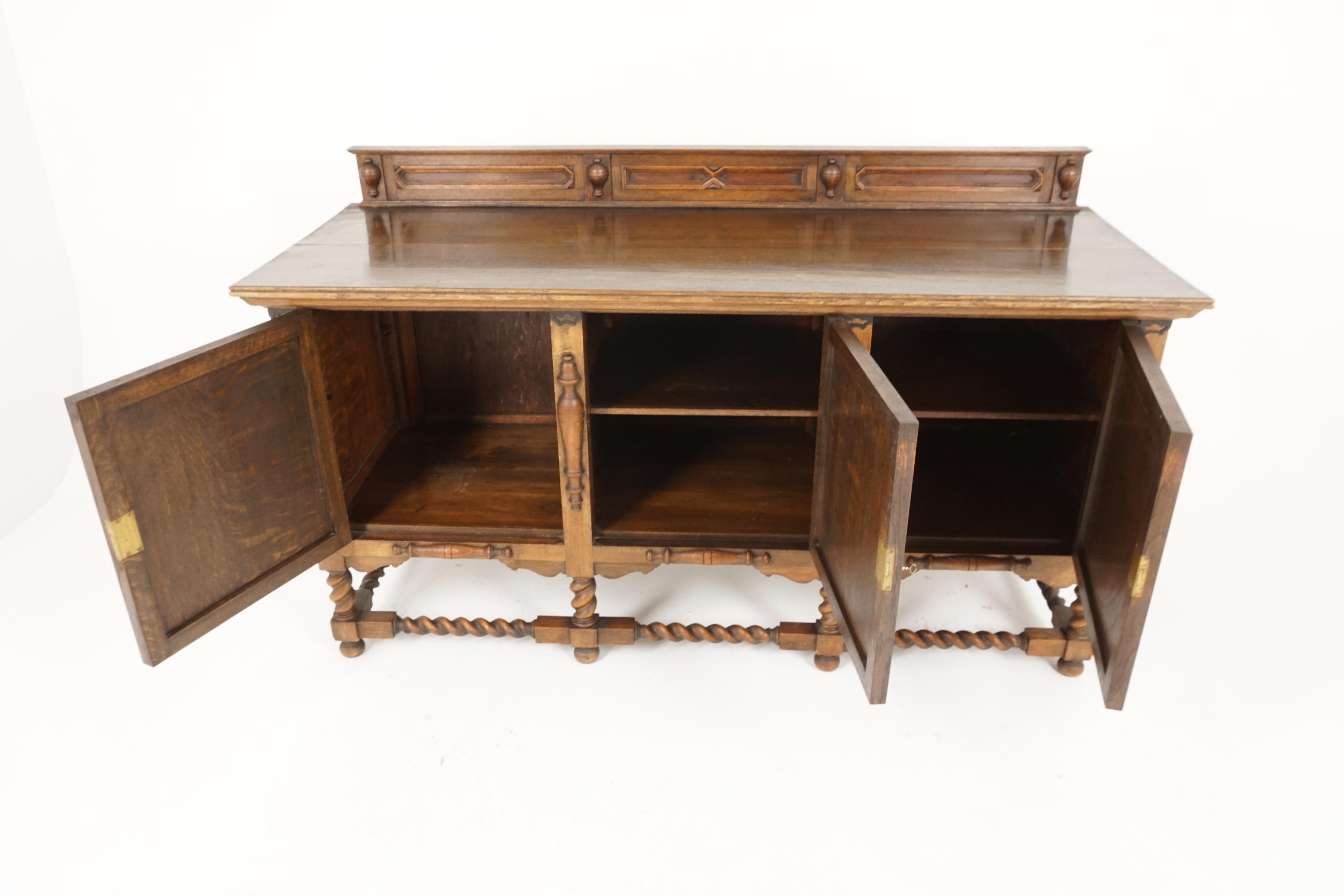 Antique tiger oak barley twist sideboard buffet, Scotland 1920, B2142

Scotland, 1900
Solid oak 
Original finish
Carved pediment on back
Rectangular top with moulded edges
Central paneled door with single fixed shelf interior
Flanked by a