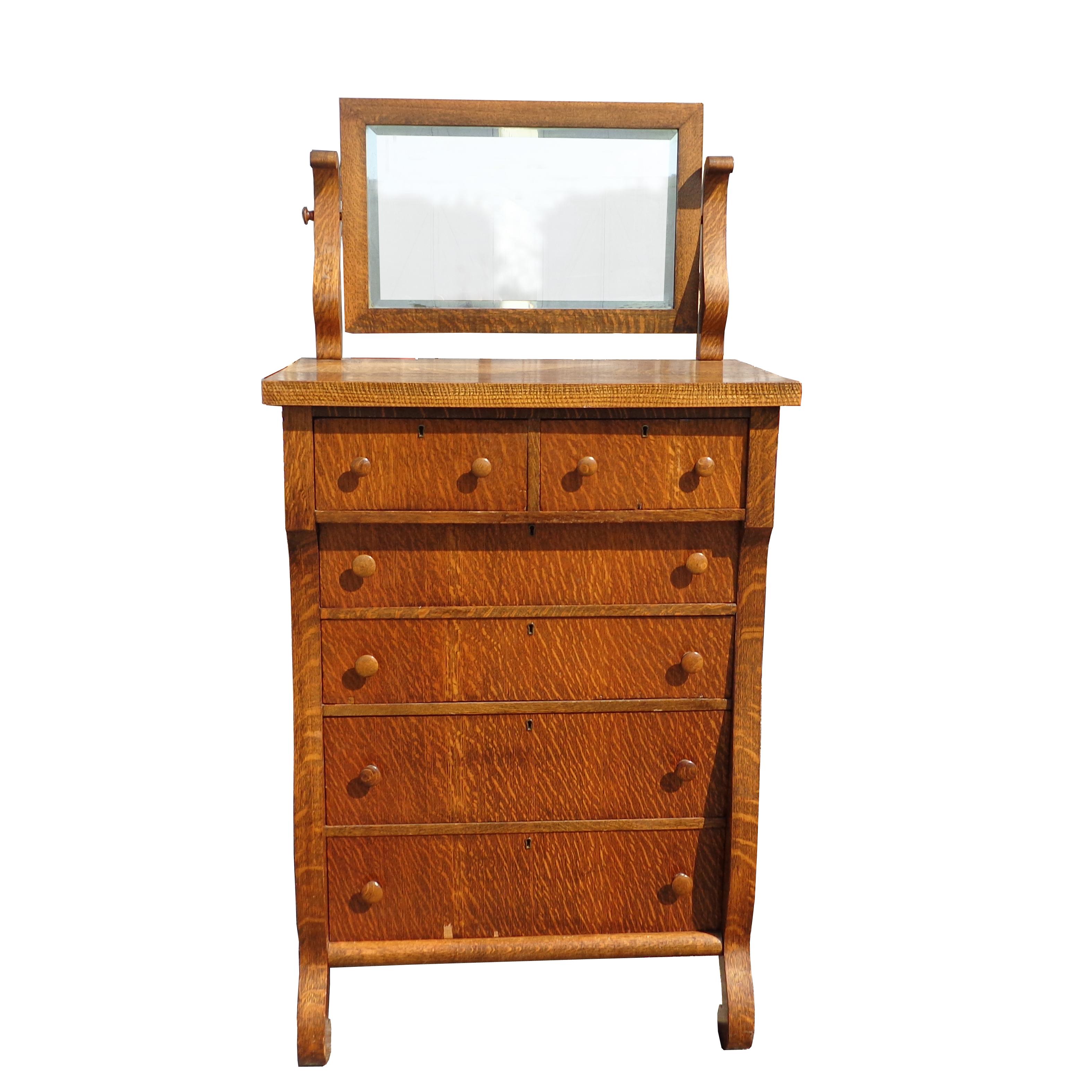 Antique tiger oak highboy dresser

Predating the mission style, 1900-1920s.
Six drawers with locking mechanism.
Solid oak top, swivel mirror and dove tailed construction.


 
   