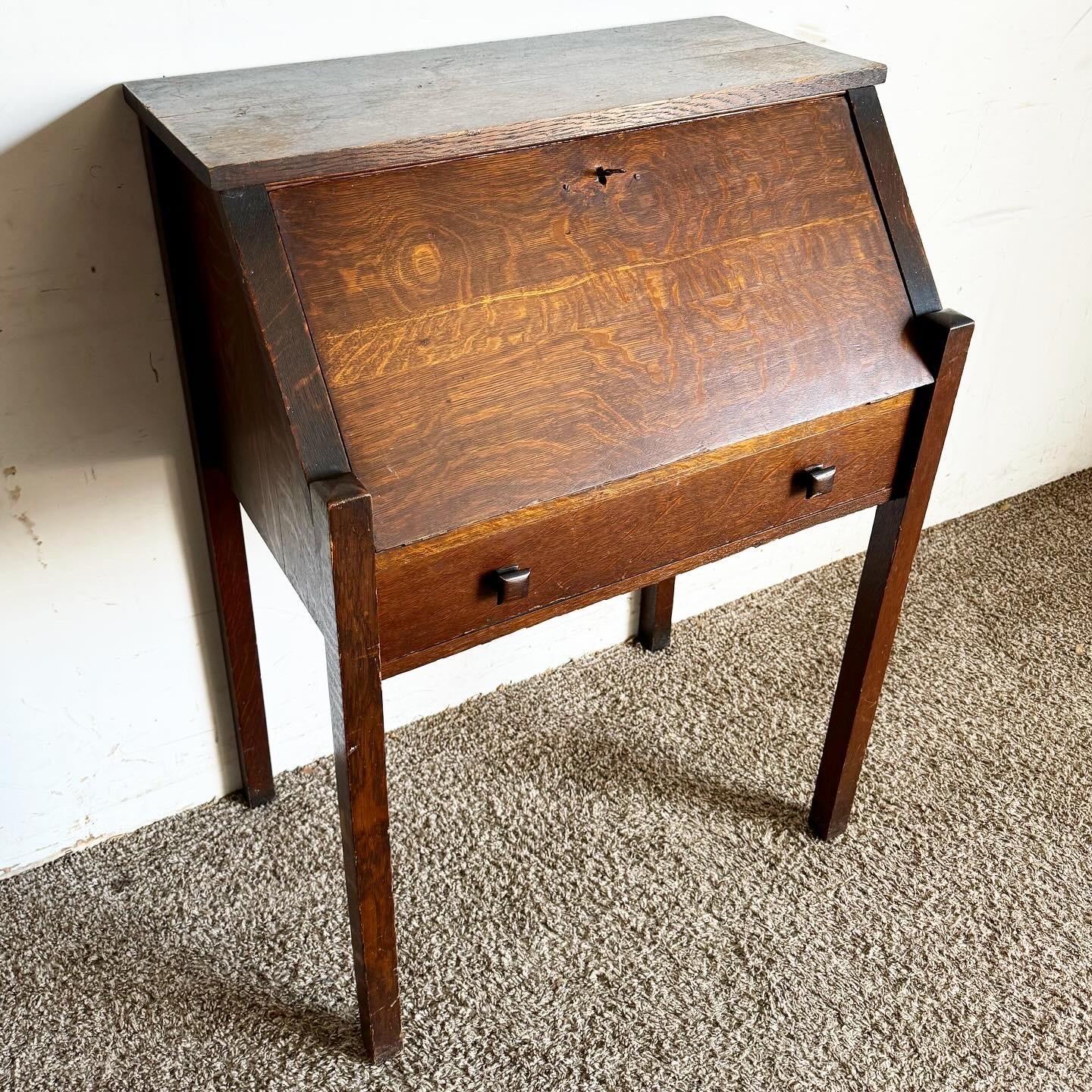 Discover the timeless elegance of the Antique Tiger Oak Secretary Desk by Danner, featuring exquisite craftsmanship, functionality, and historic charm for your office or study space.
Vintage pieces may have age-related wear. Review photos carefully,