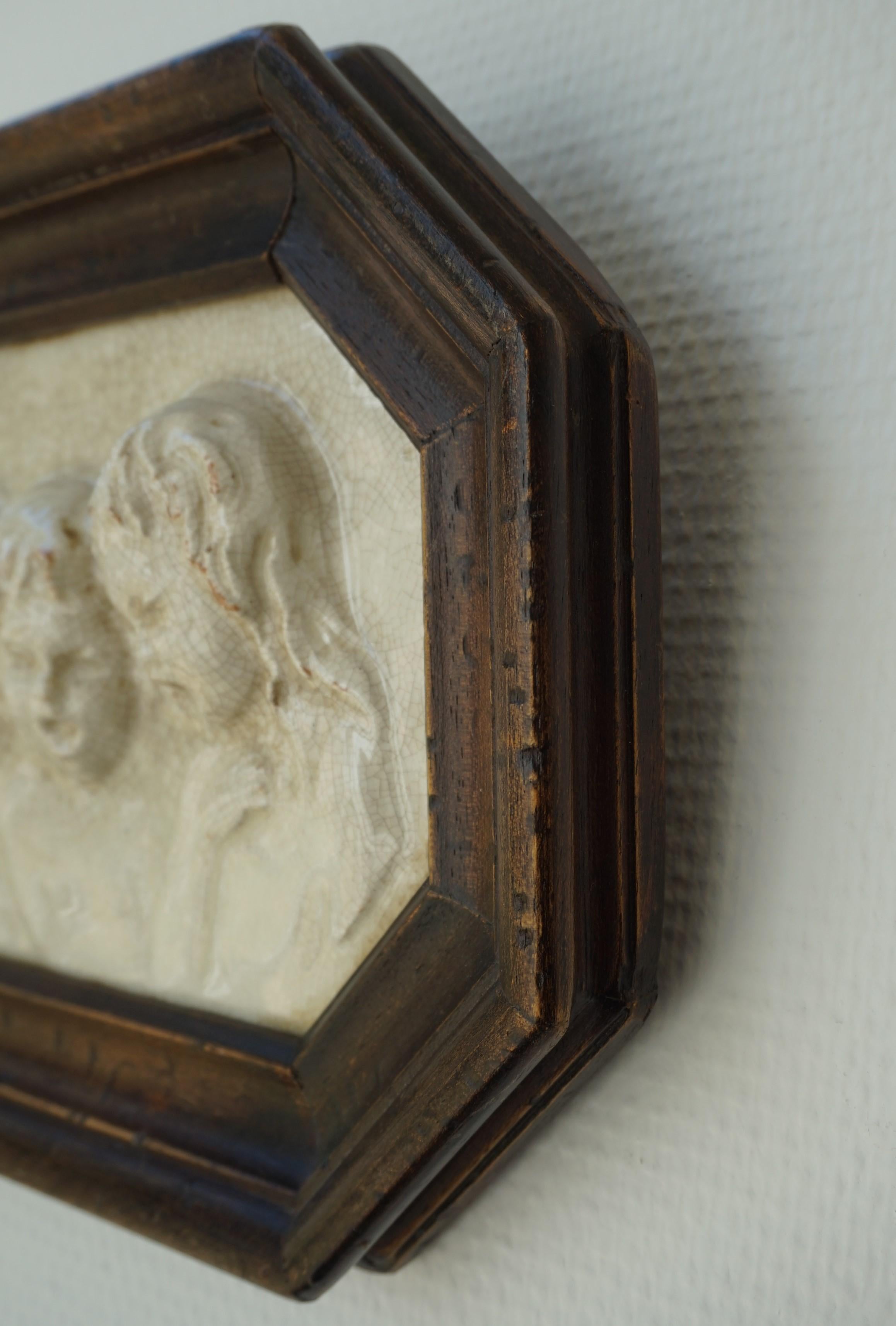 Glazed Antique Tile in Frame with Devout Singing Angelic Children Sculptures in Relief For Sale