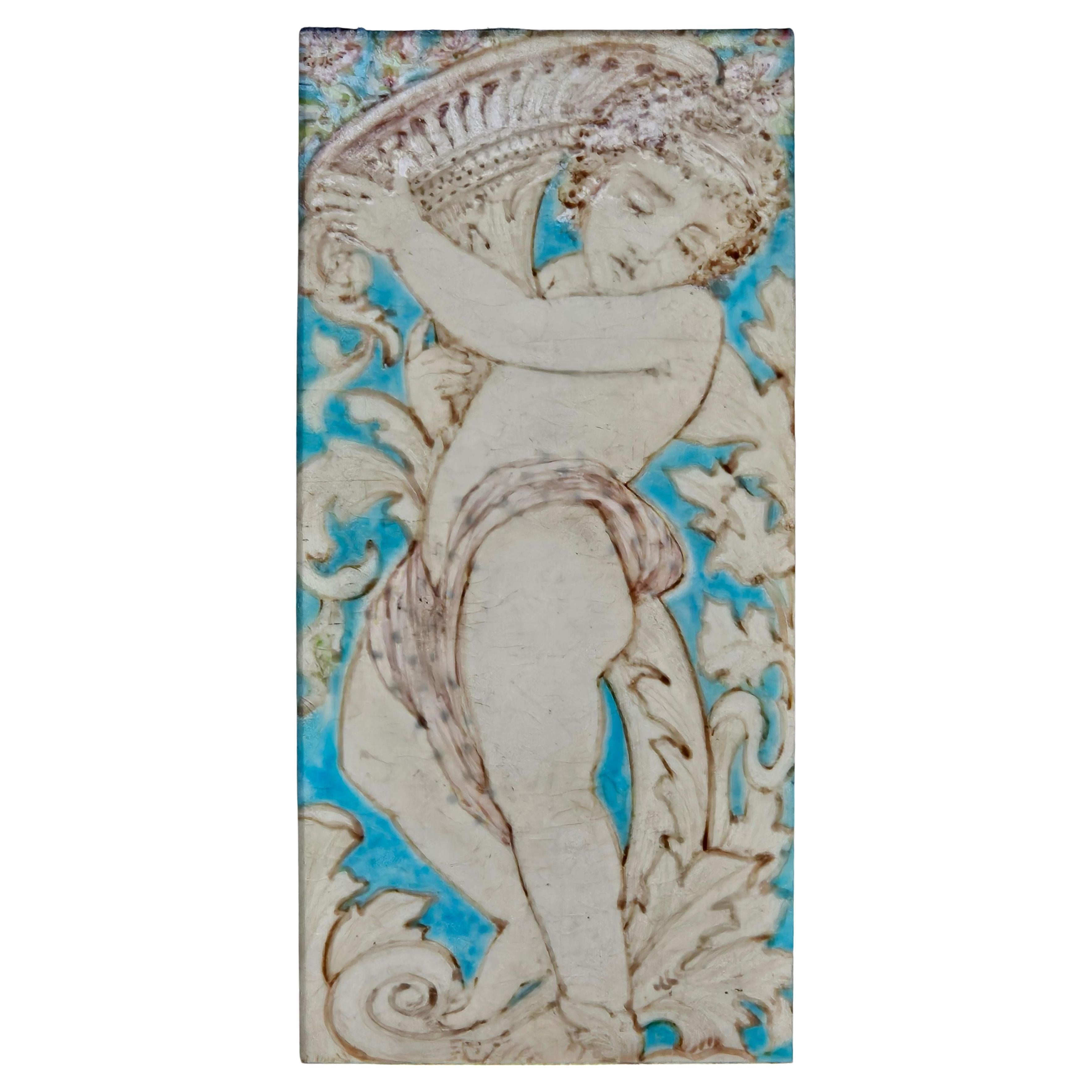 Antique Tile, Mintons, Hollins, & Co., depicting putto,  c. 1880, molded maker's mark, tile 8 x 4, frame 8 1/2 x 4 1/2 in.
