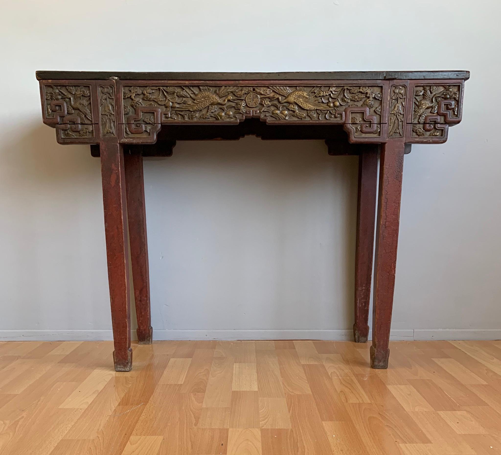 Stunning antique Asian side table with flying crane bird motifs and more on all sides.

One of the great advantages of this antique Chinese side or altar table is that it can be incorporated in all kinds of interior styles, even a contemporary