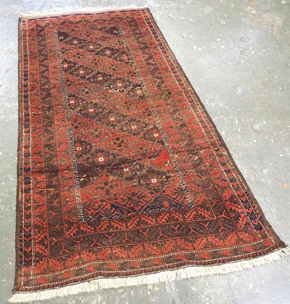 Antique Afghan Timuri Baluch rug from Western Afghanistan with diagonal lattice design
Circa 1890

A good Timuri Baluch rug from Western Afghanistan, the diamond lattice contains a gul like design in diagonal rows of alternating colour, madder red