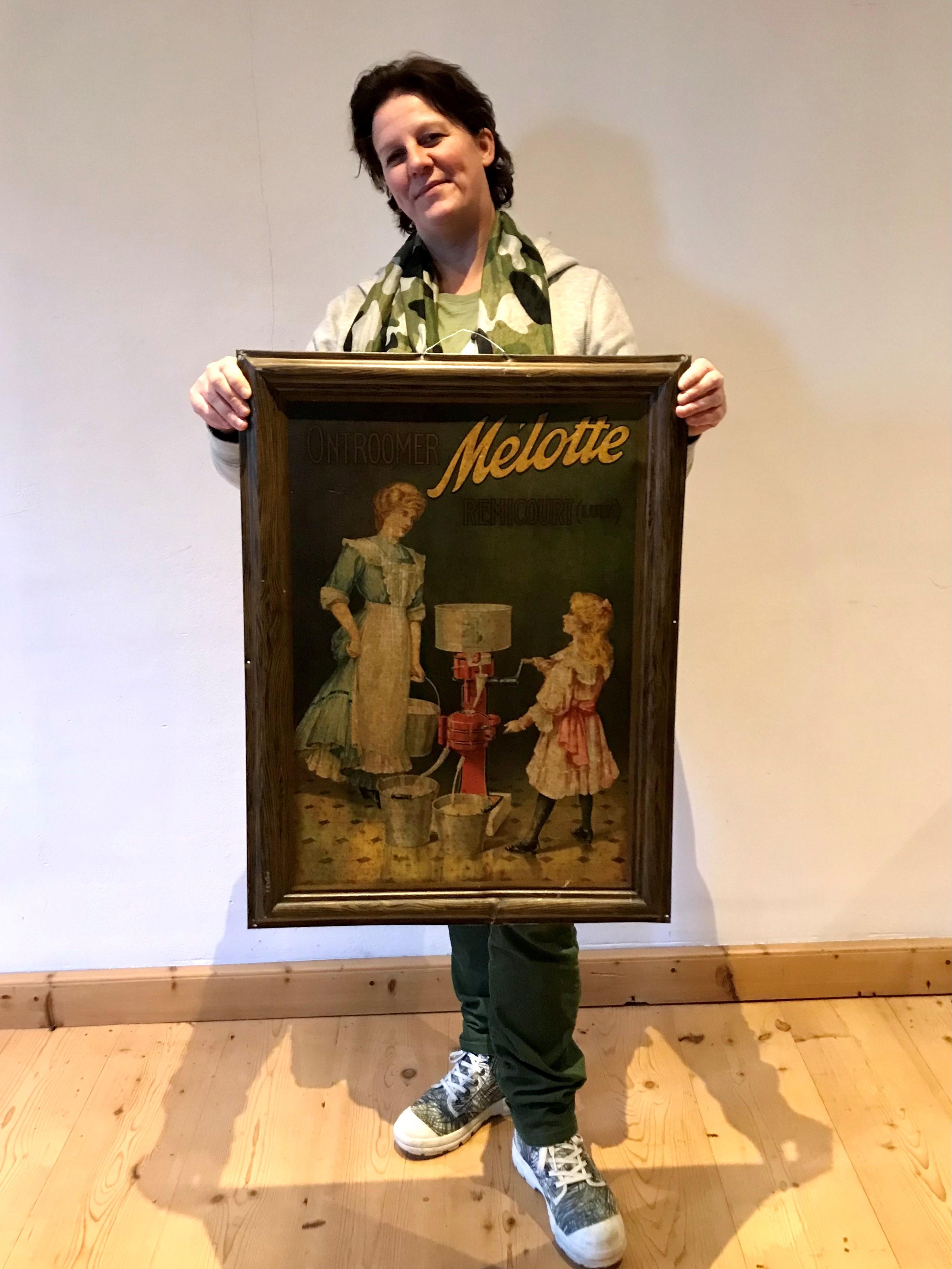 Antique large tin sign for the Belgian cream separator brand Mélotte, which was based in Belgium in Remicourt in the province Luik - LIège. 
This large advertising sign dates circa 1900-1920. 
It has a beautiful design: a woman and daughter