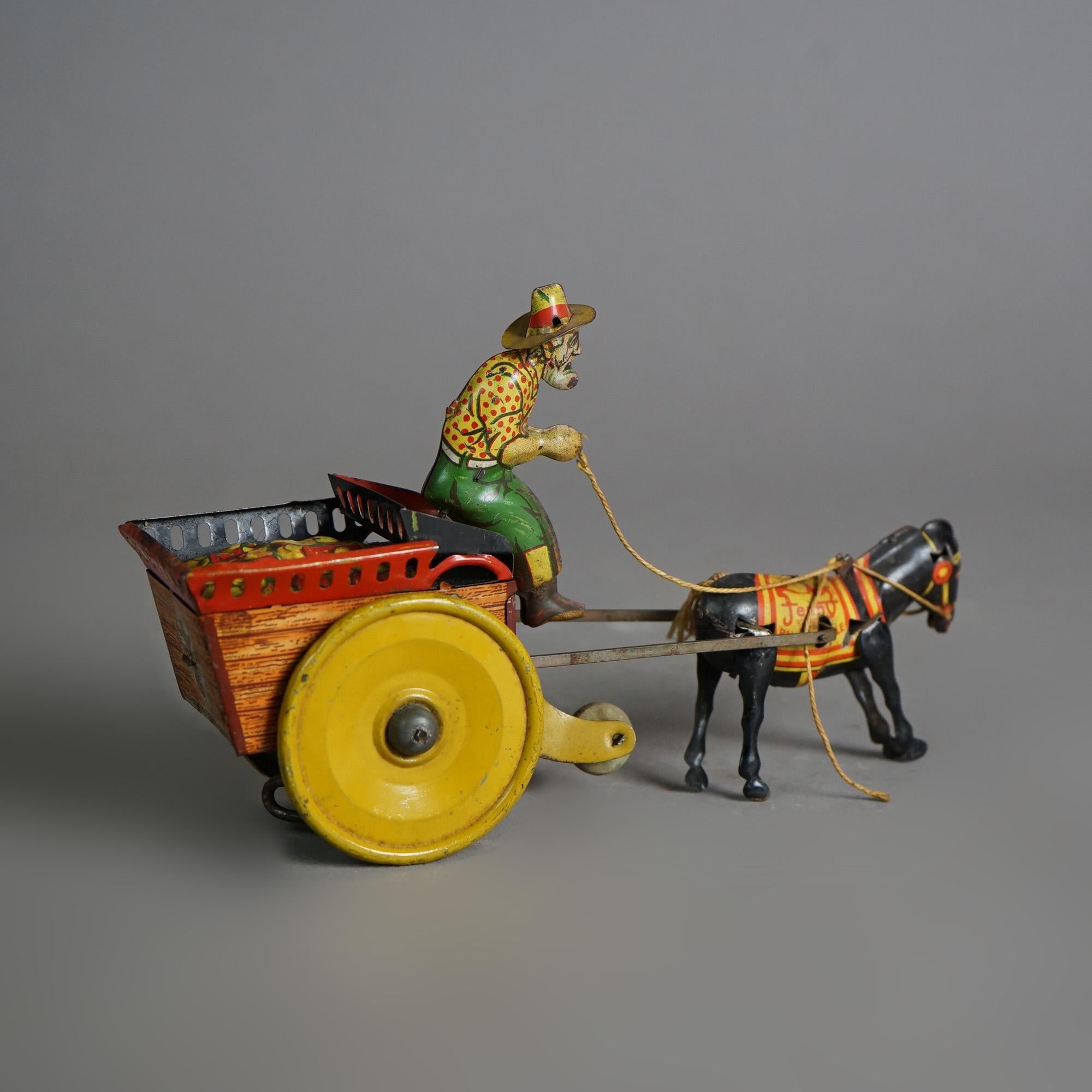 Antique Tin Wind-Up Toy by The Ferdinand Strauss Corp; Man, Mule & Wagon; c1920 In Good Condition In Big Flats, NY