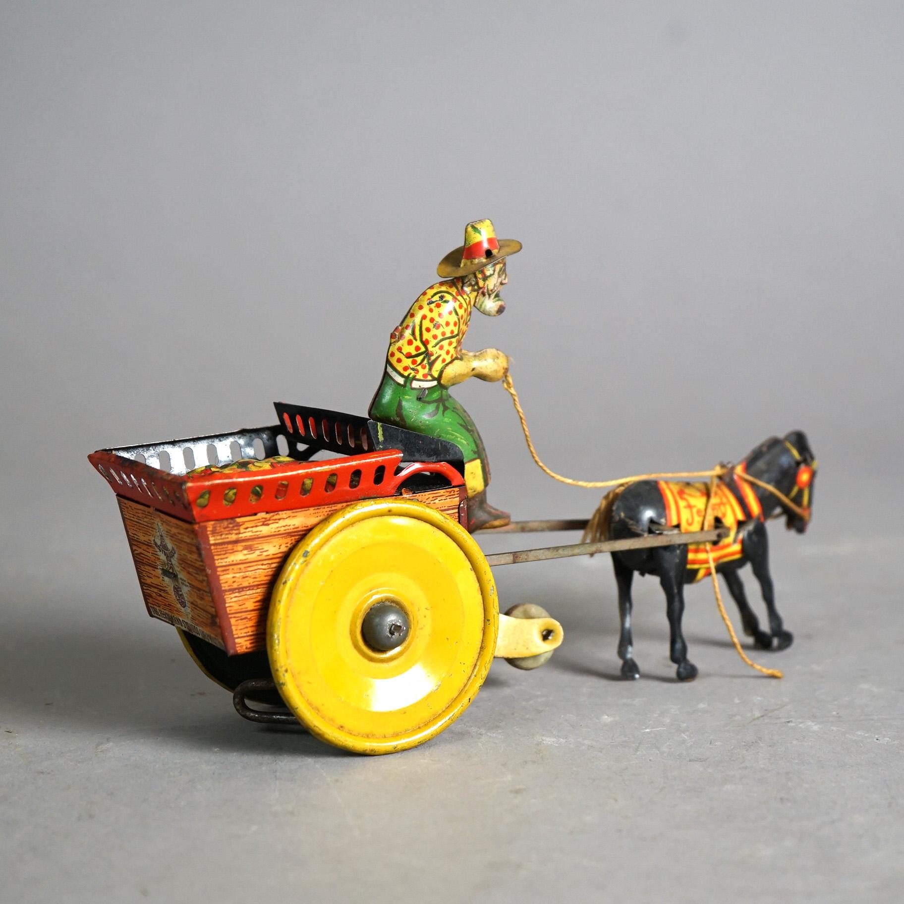 20th Century Antique Tin Wind-Up Toy by The Ferdinand Strauss Corp; Man, Mule & Wagon; c1920