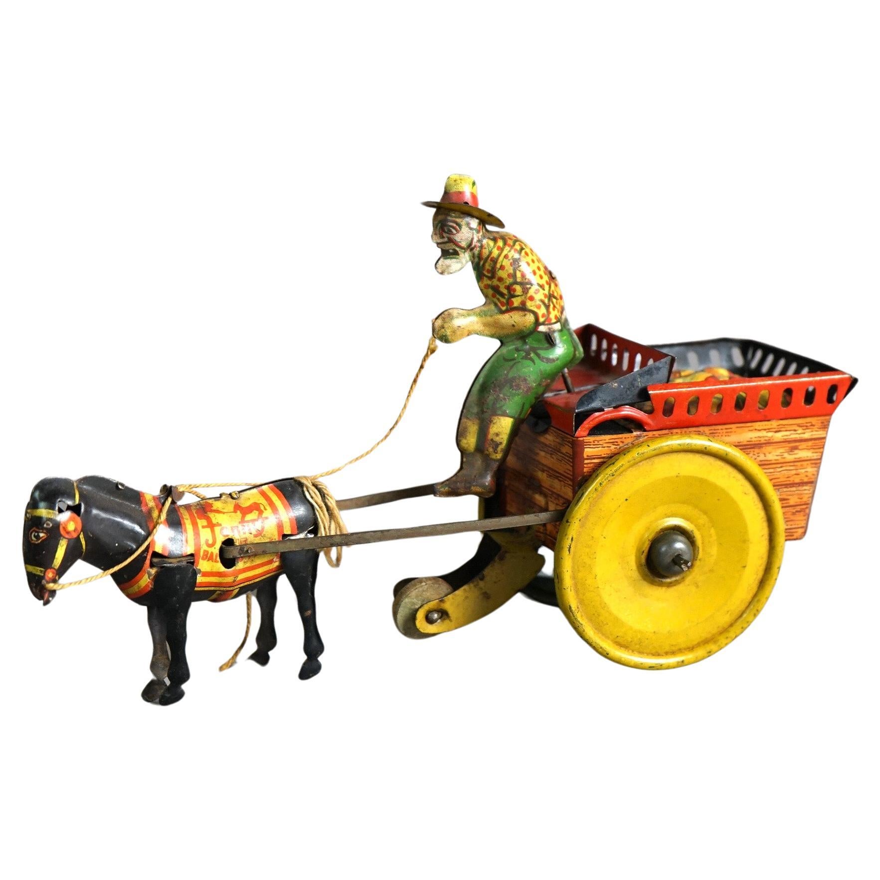 Antique Tin Wind-Up Toy by The Ferdinand Strauss Corp; Man, Mule & Wagon; c1920