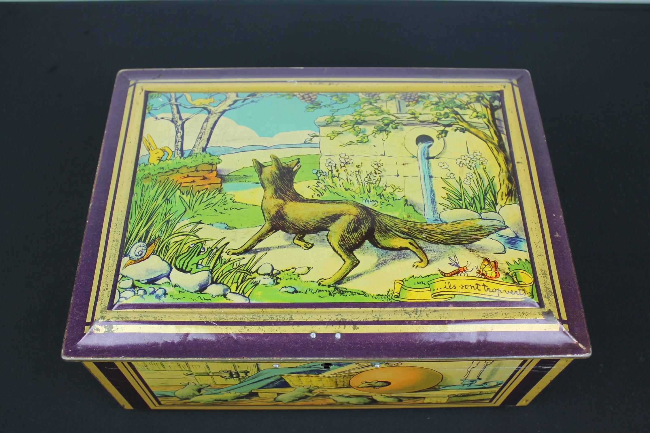 Antique tin with lots of animals by De Wulf Brussels. 
This Belgian storage tin dates circa 1940s and has a great design of nature landscapes with many animals like wolf, frog, hare, butterfly, dragonfly, snail, mice, sheep, fox, ants, snake, crow,