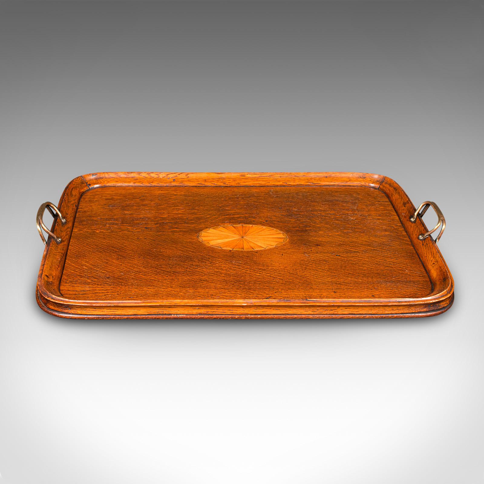
This is an antique tipple serving tray. An English, oak and boxwood inlaid afternoon tea platter, dating to the Edwardian period, circa 1910.

Appealingly presented tray with a distinctive appearance
Displays a desirable aged patina and in good