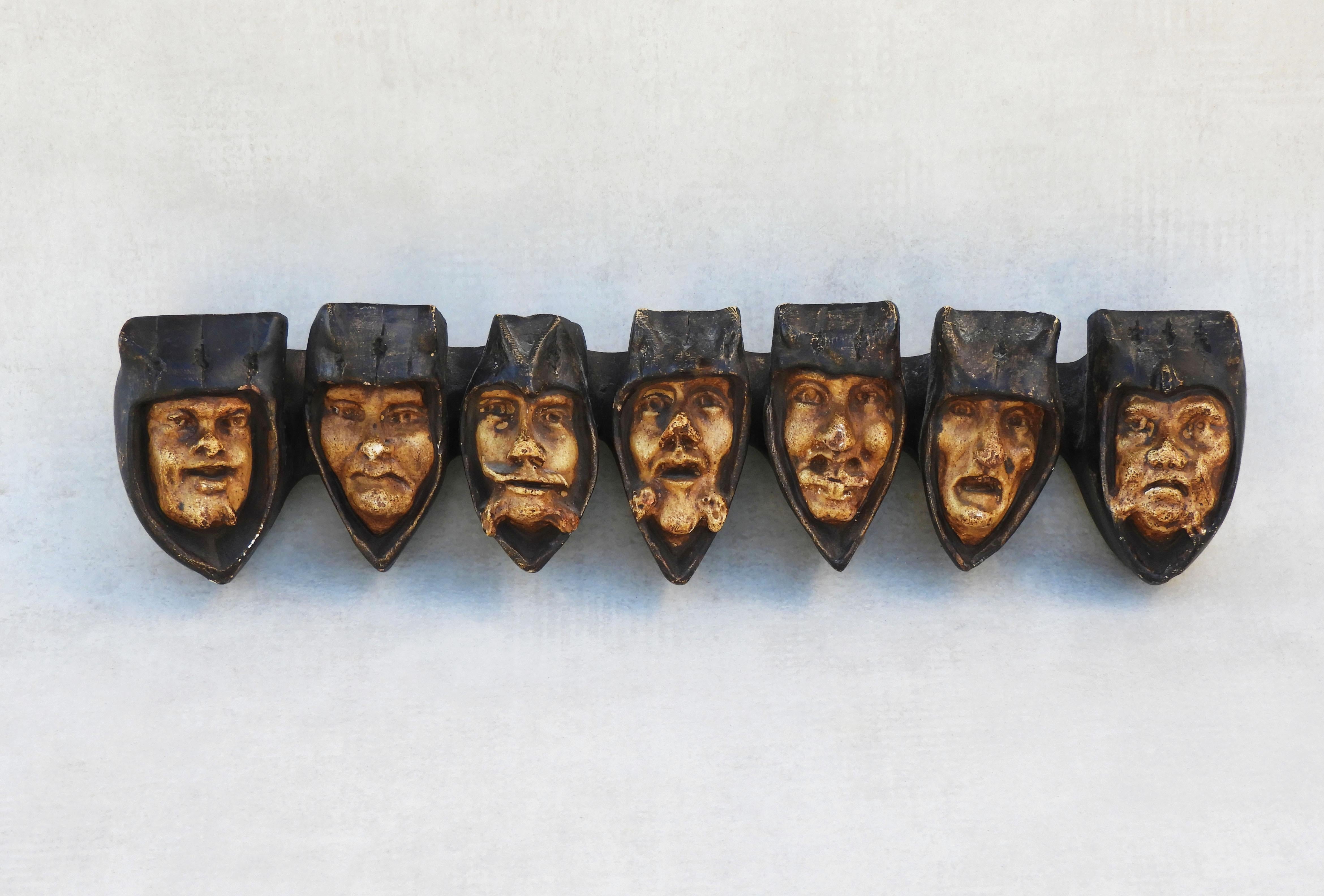 Antique pipe rack wall art sculpture 'Seven Deadly Sins' From Early 20th Century France. 
A grotesquerie of hooded monks representing the seven deadly sins. A rare and practical example of early 20th century French tobacciana, this curious smokers'