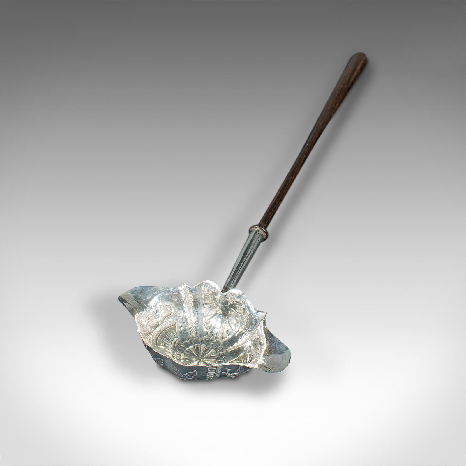 This is an antique double lip toddy spoon. An English, silver serving ladle, dating to the Georgian period, hallmark for 1772.

Fascinating example of Georgian decorative tableware
Displays a desirable aged patina and in very good
