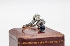 Antique toi et moi ring with diamonds and cabochon-cut sapphire, early 20th cent