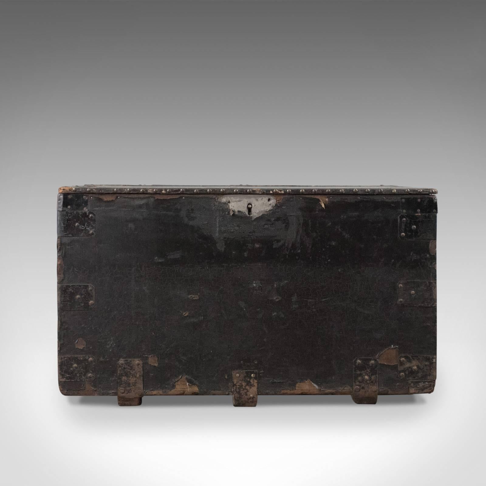This is an antique tool chest, an English, Victorian, metal bound, mahogany trunk dating to circa 1900.

Charming original finish displaying desirable, distressed character
Metal bound and riveted for strength over good quality mahogany
Iron