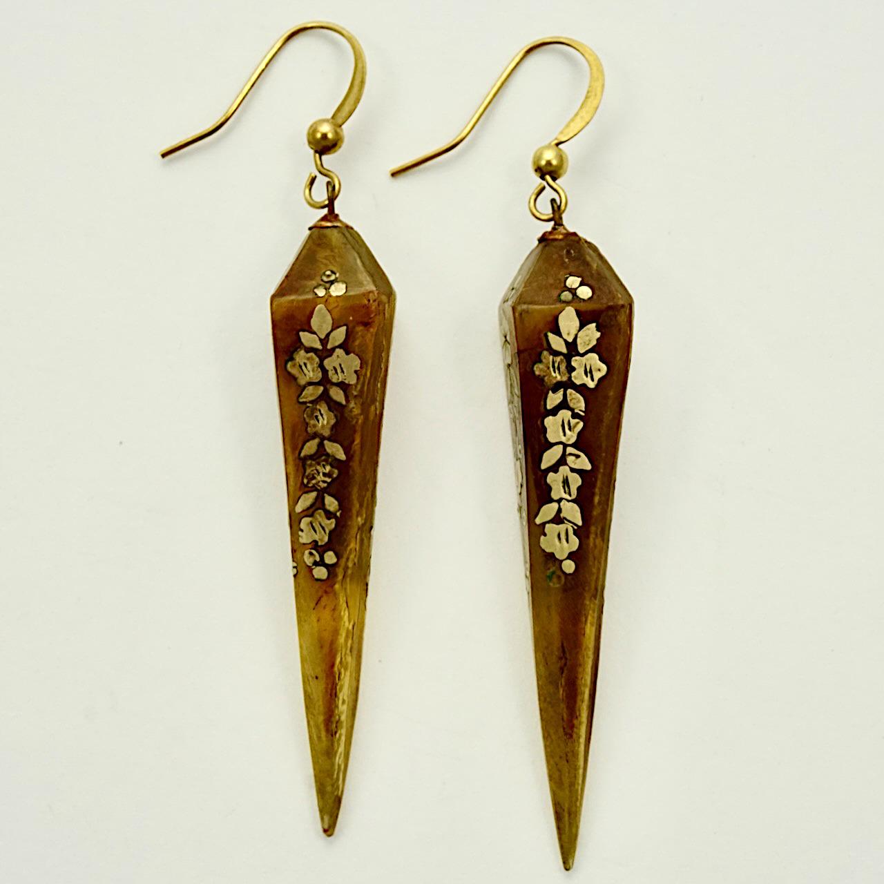 Lovely antique torpedo drop earrings, with a gold tone (possibly gold) inlaid flower and scroll design. We have added the new brass hooks. Measuring, not including the hooks, length 5 cm / 1.9 inches. A very few pieces of inlay are missing, one