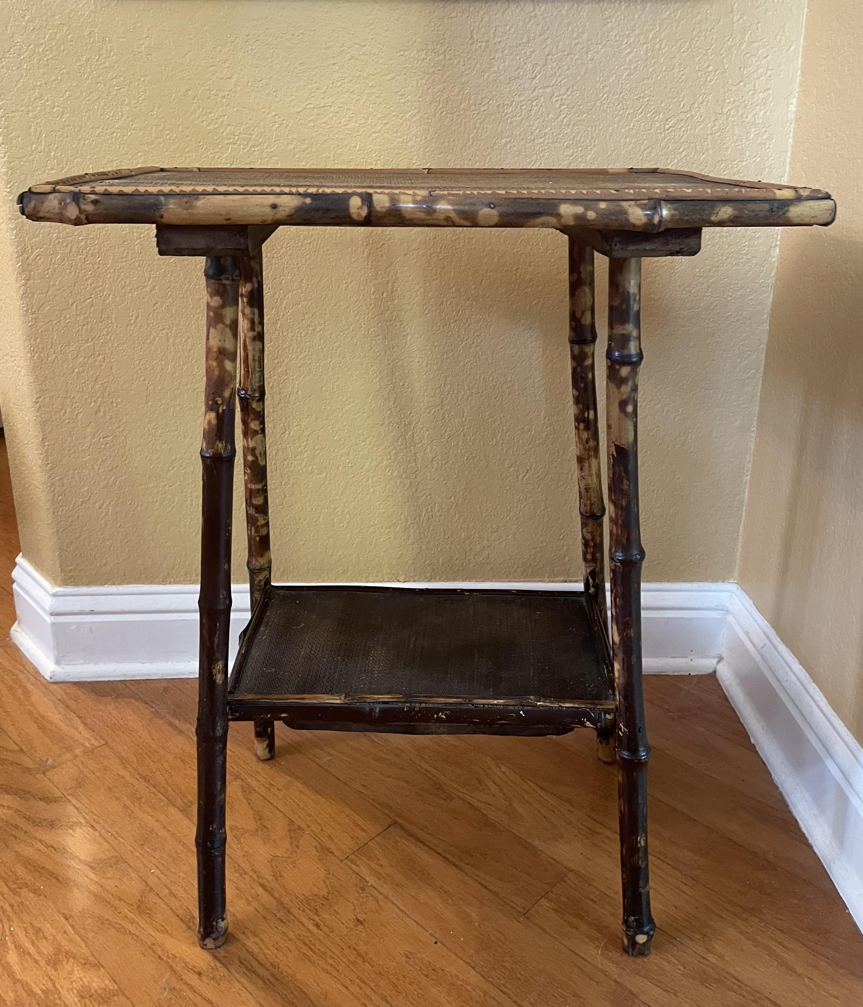 An antique 'all-over' tortoise pattern bamboo side table from South Asia. A distinctive and soulful piece that is well crafted. The 'tortoised bamboo' in furniture is sought after, yet harder to find. It's more common to find plain brown bamboo,