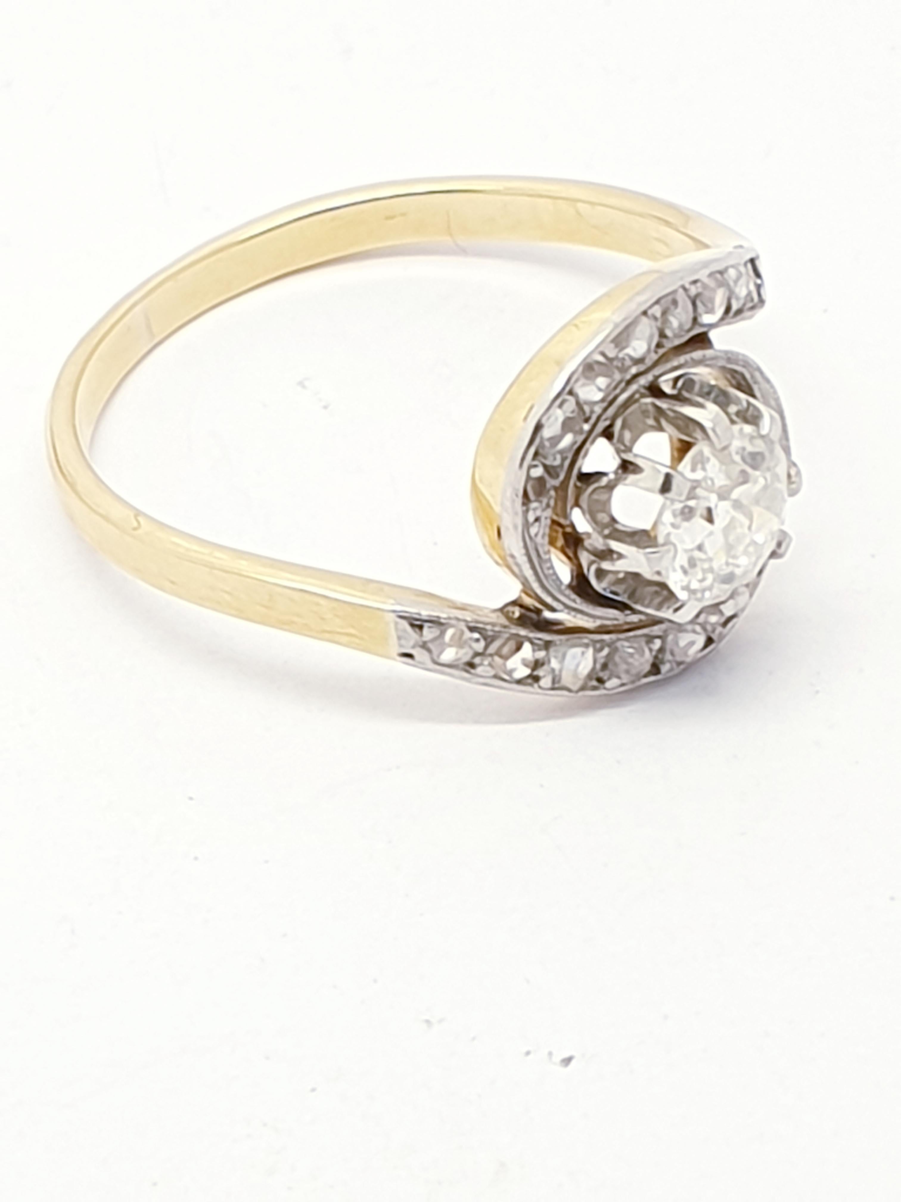 Antique late 19th Century tourbillon or swirl diamond ring. French origin. The center is set with 0.55 ct old cut diamond ,the platinum dipped swirl part set with 18 rose cut  diamonds. Eagle hallmark for 18 kt gold. Very unique beautiful old piece.