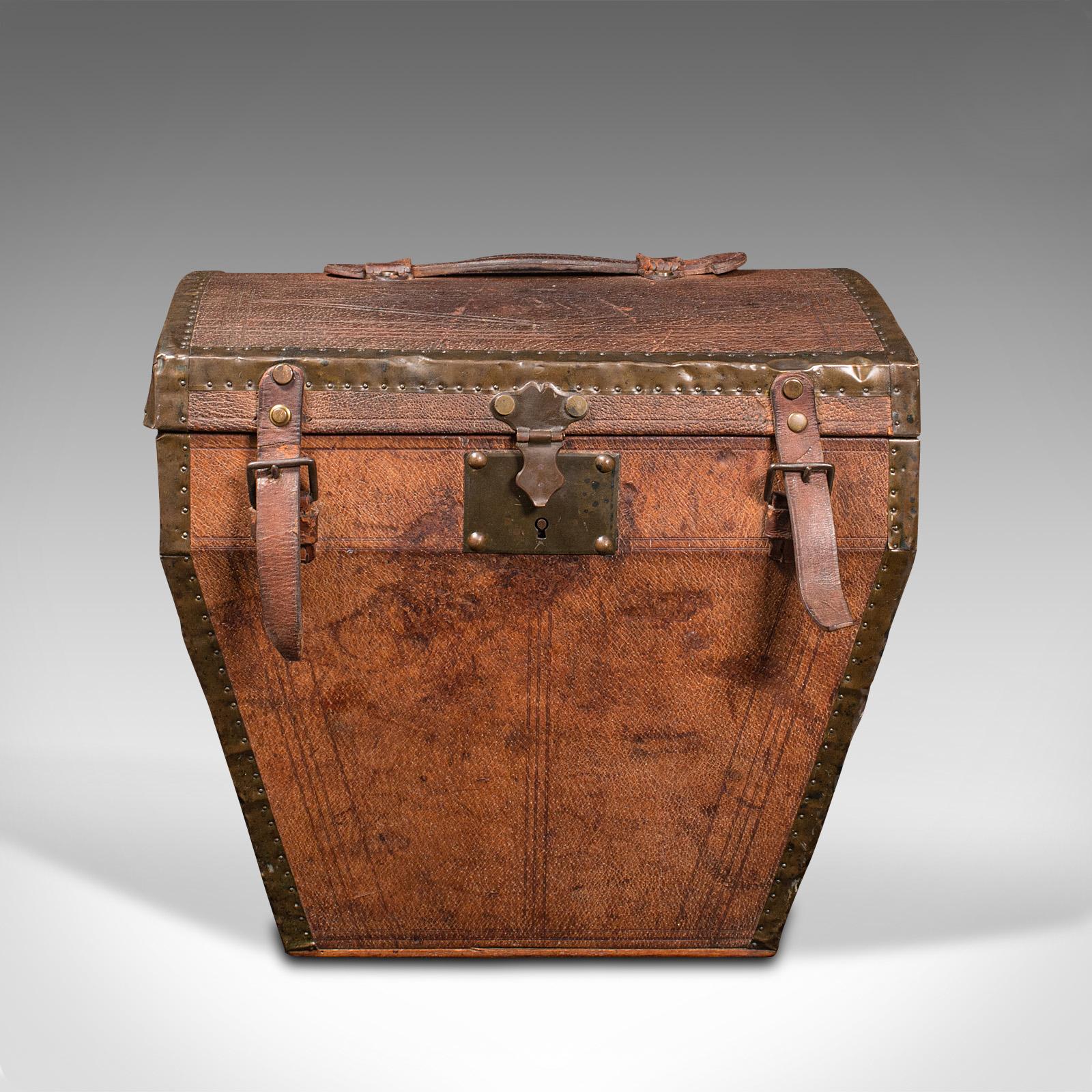 This is an antique touring hat box. A French, leather and brass travel case, dating to the early Victorian period, circa 1850.

Superb bombe hat box with fine French travel appeal
Displays a desirable aged patina and in good original order
Rich
