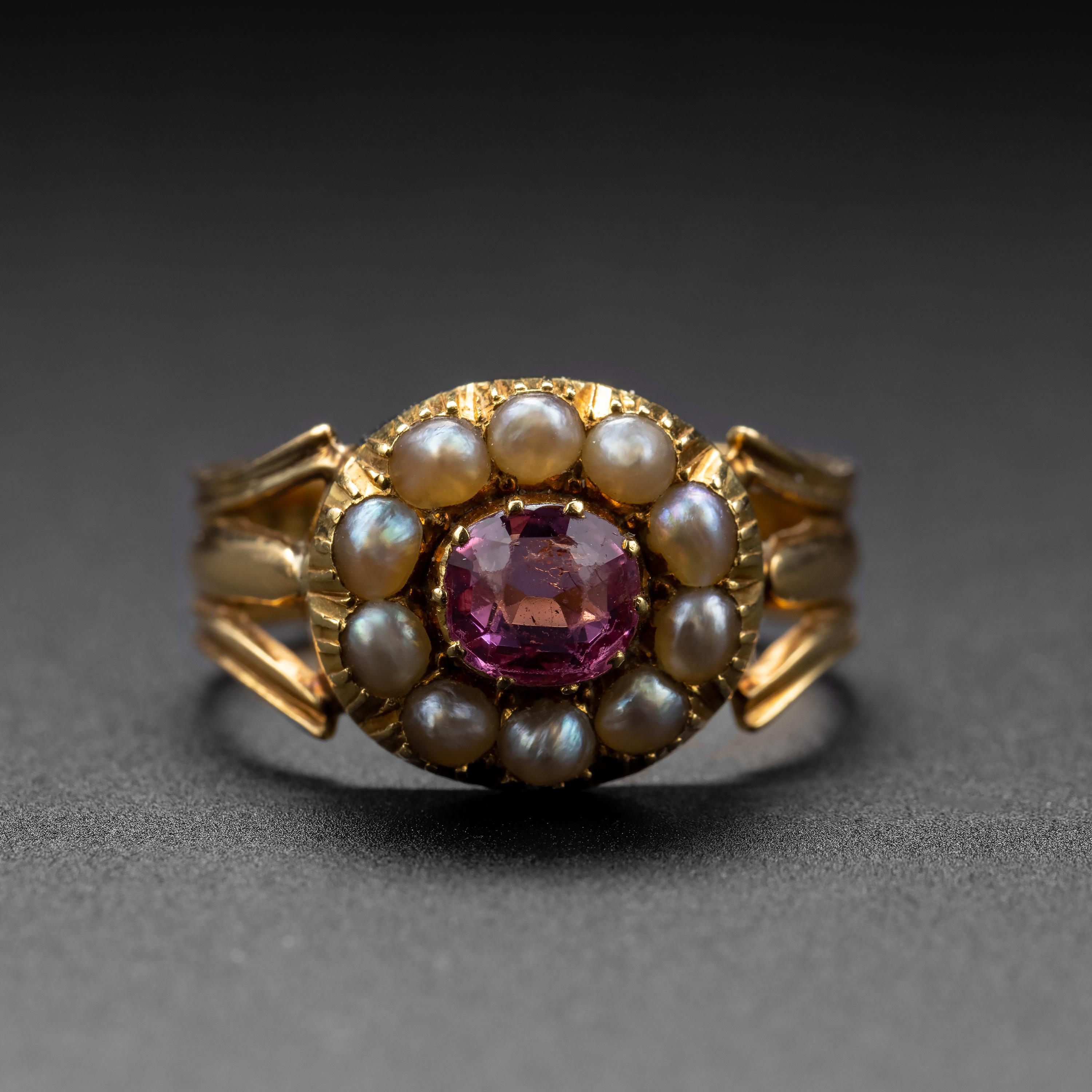 A bright pink tourmaline weighing .60 carats is surrounded by 10 luminous natural saltwater pearls in this antique 18K yellow gold ring. This gorgeous jewel dates from around 1840, though possibly earlier. The gorgeous tourmaline is bezel-set and