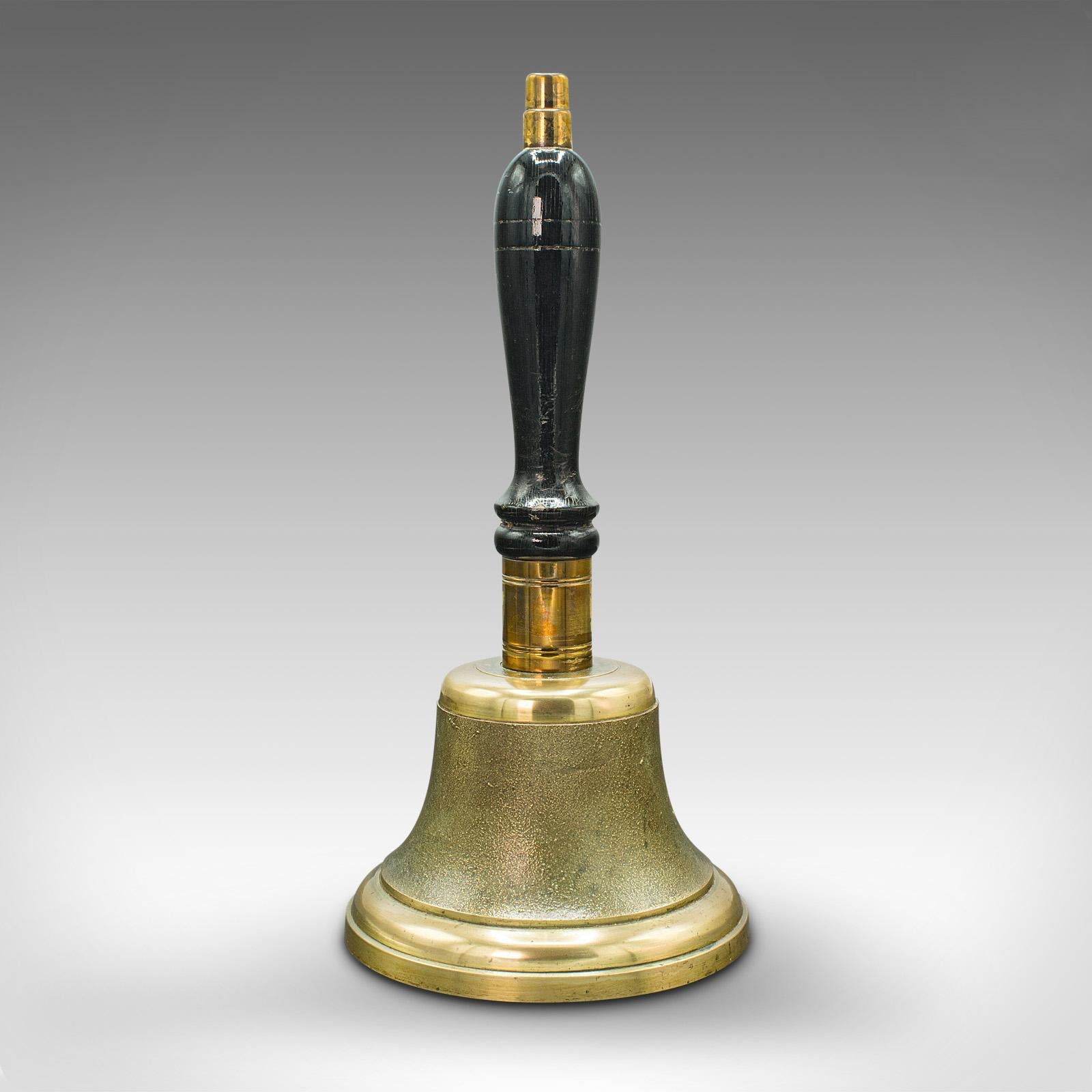 This is an antique town clerk's hand bell. An English, brass and mahogany school yard ringer, dating to the Edwardian period, circa 1910.

Delightfully presented hand bell, with decorative appeal
Displays a desirable aged patina and in good