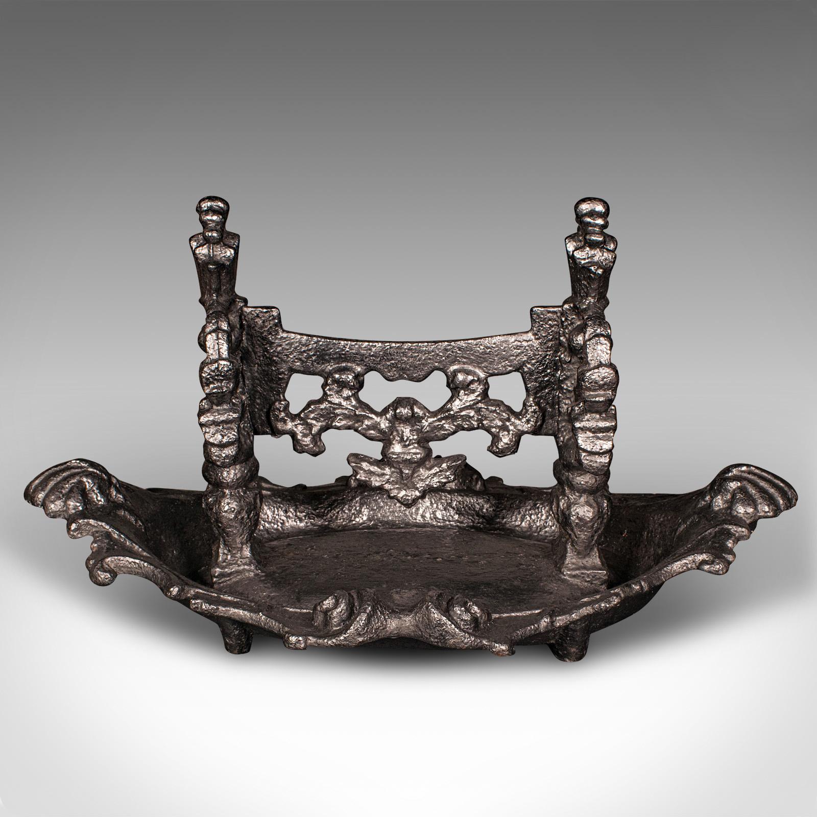 
This is an antique townhouse boot scraper. An English, cast iron Great Exhibition doorway shoe pull, dating to the early Victorian period, circa 1850.

Gloriously extravagant and substantial - a treat for a grand entrance
Displaying a desirable