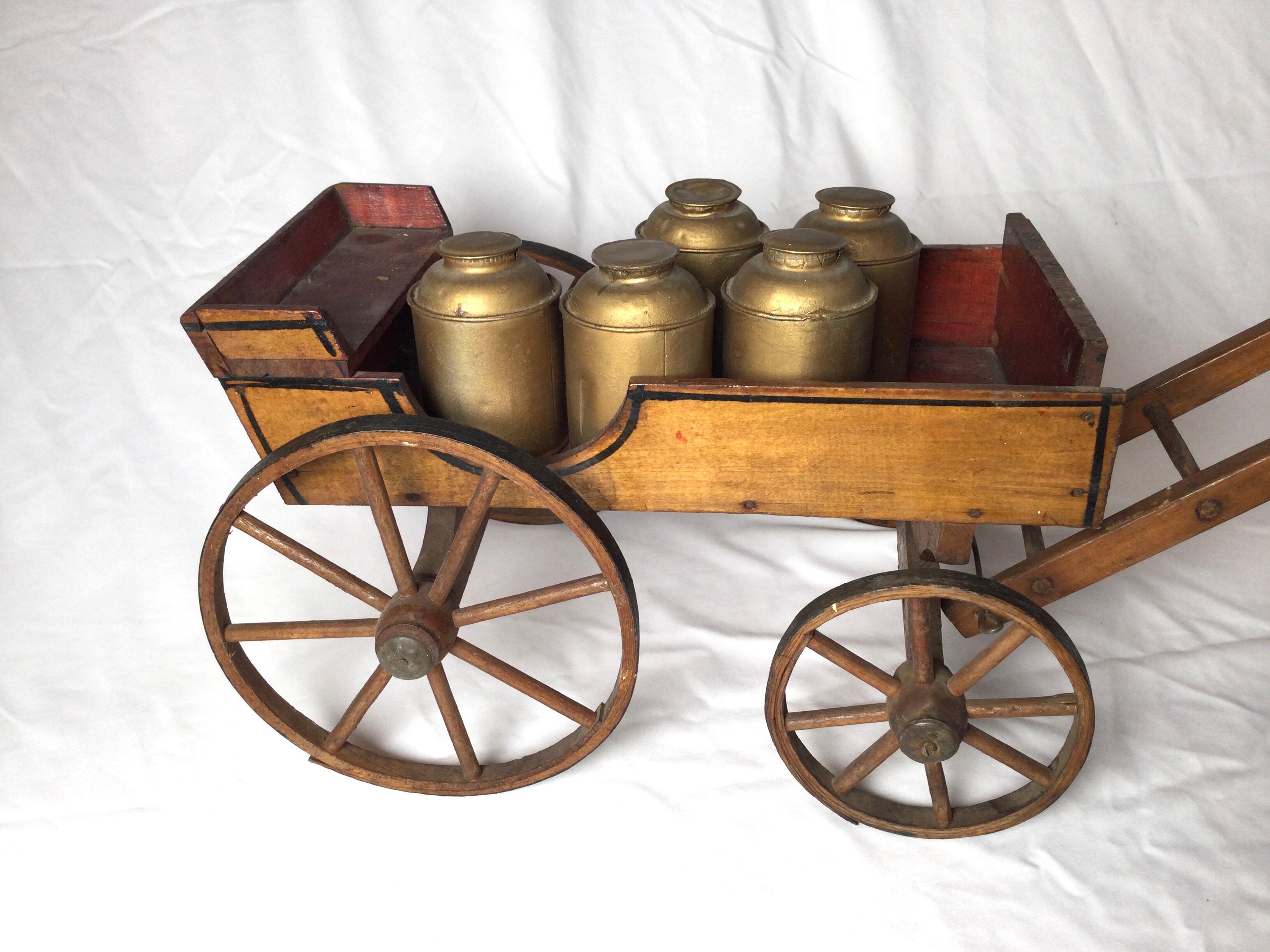Antique toy mohair horse with primitive milk wagon. Wagon has metal cans and original wood wheels. Wheels on front are 4.5