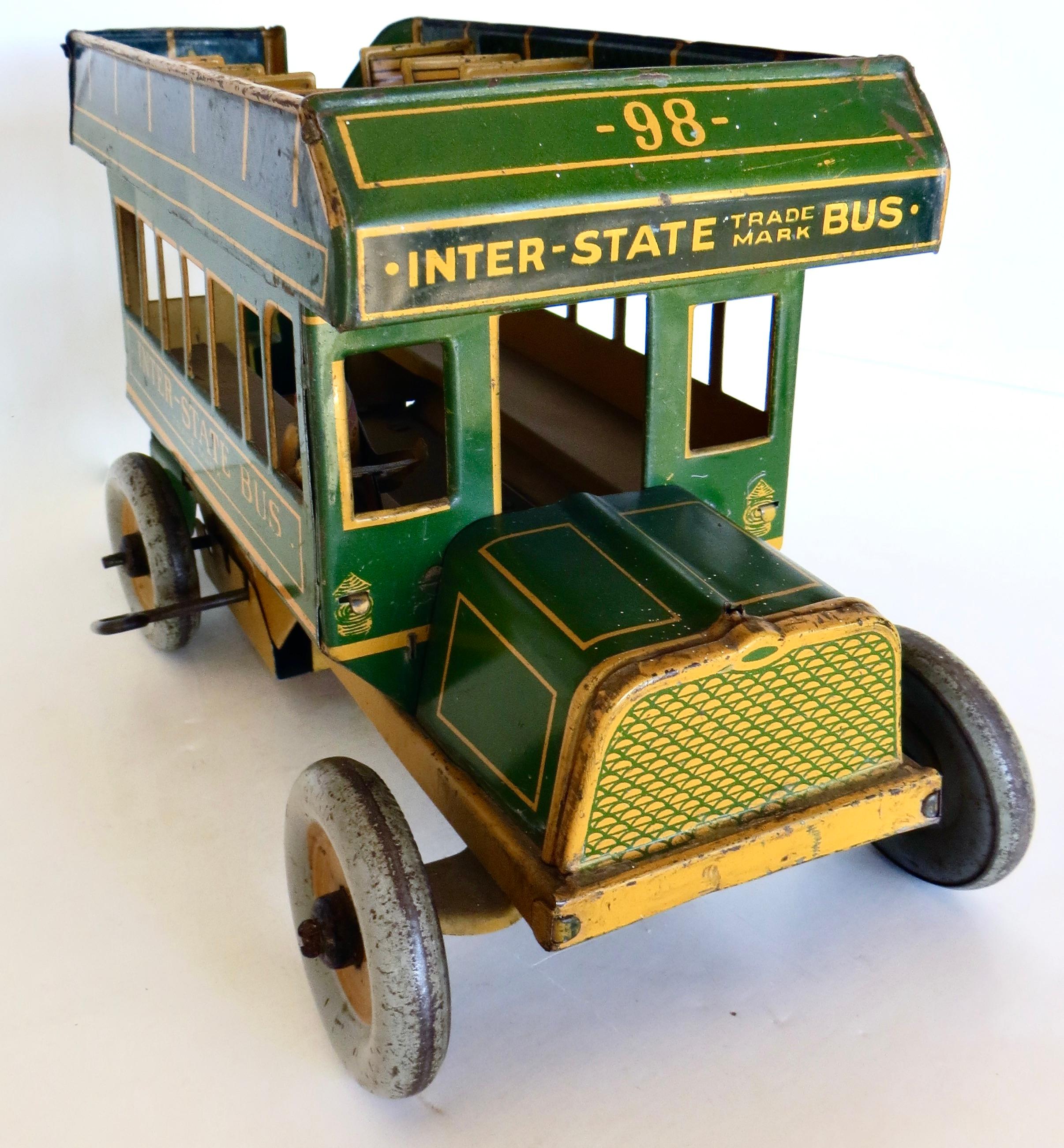 Antique Wind-Up Double Decker open air bus by the Ferdinand Strauss Toy Company, New York; circa 1925; is quite a large and substantial toy resembling very closely, buses of that era. 
Ferdinand Strauss was a German toy maker who started his company