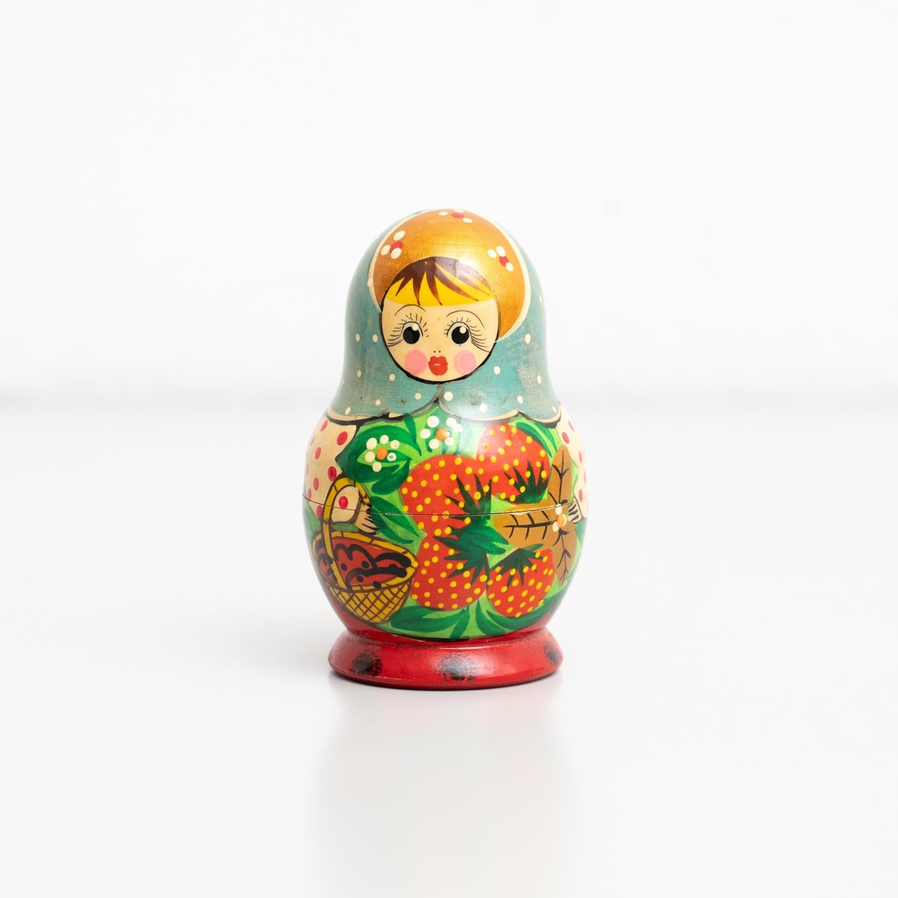 Traditional Russian 'Matrioska' doll wooden figure. Hand-painted.    Made by unknown manufacturer in Russia, circa 1960.    In original condition, with minor wear consistent with age and use, preserving a beautiful patina.    Materials:  Wood.   