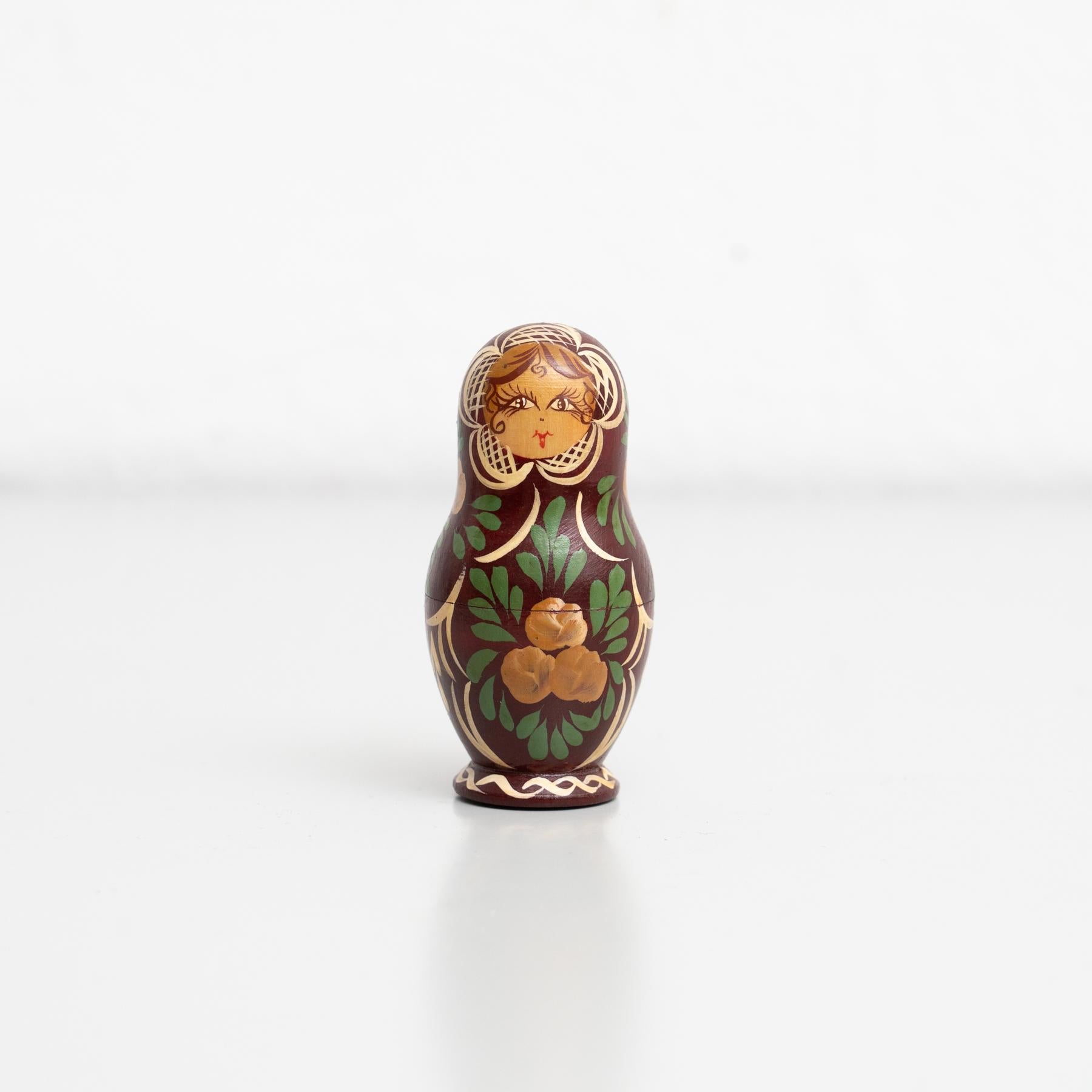 Traditional Russian 'Matrioska' doll wooden figure. Hand-painted.

Made by unknown manufacturer in Russia, circa 1960.

In original condition, with minor wear consistent with age and use, preserving a beautiful