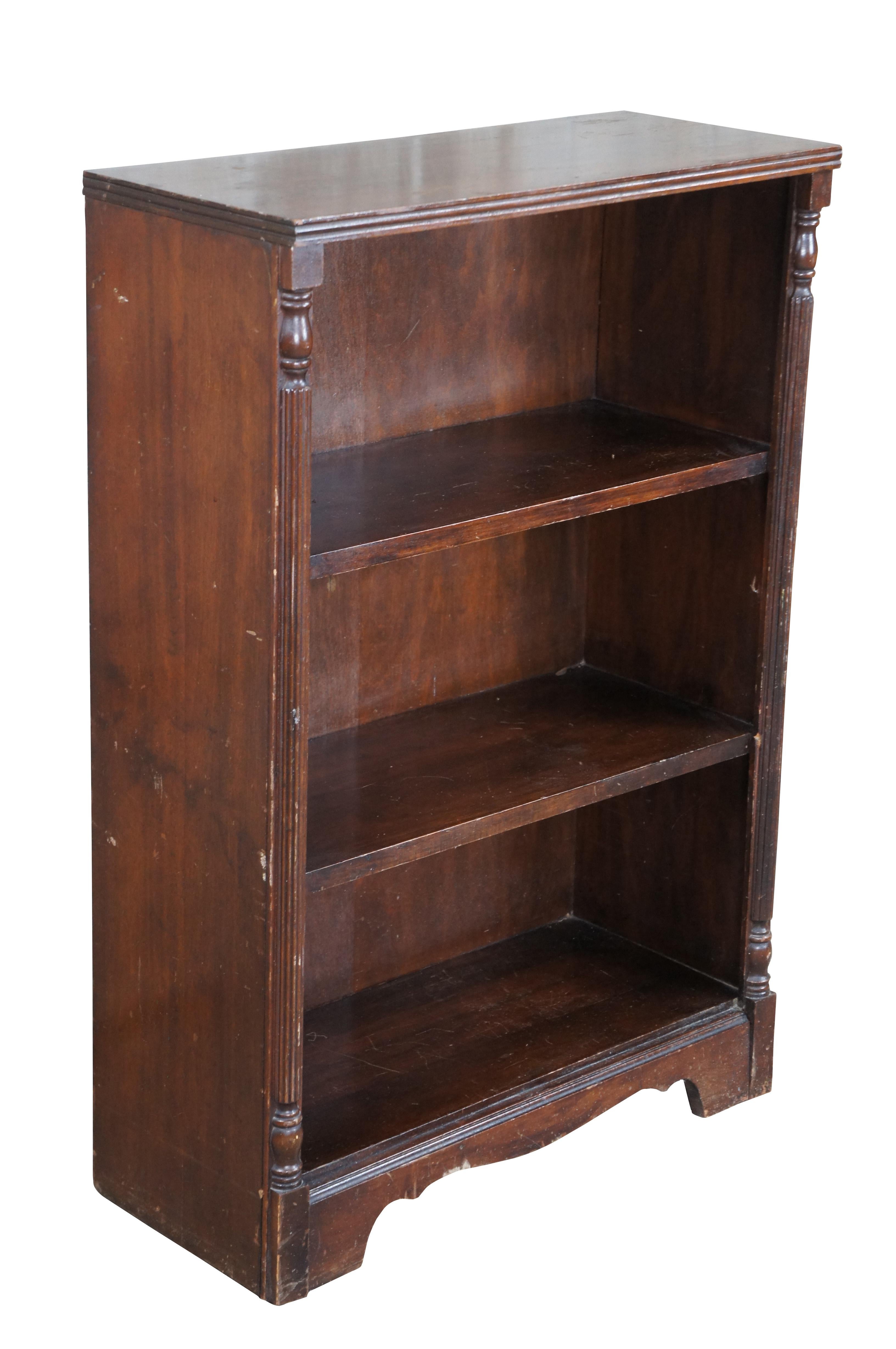 Antique mahogany bookshelf or bookcase featuring petite rectangular form with three shelves.

Dimensions:
24