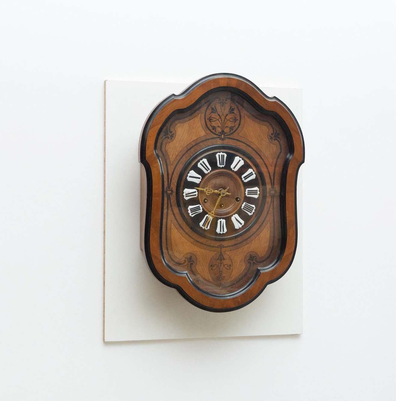 Antique traditional wall clock. By unknown manufacturer from Spain, circa 1930.
It works properly.  

In original condition, with minor wear consistent with age and use, preserving a beautiful