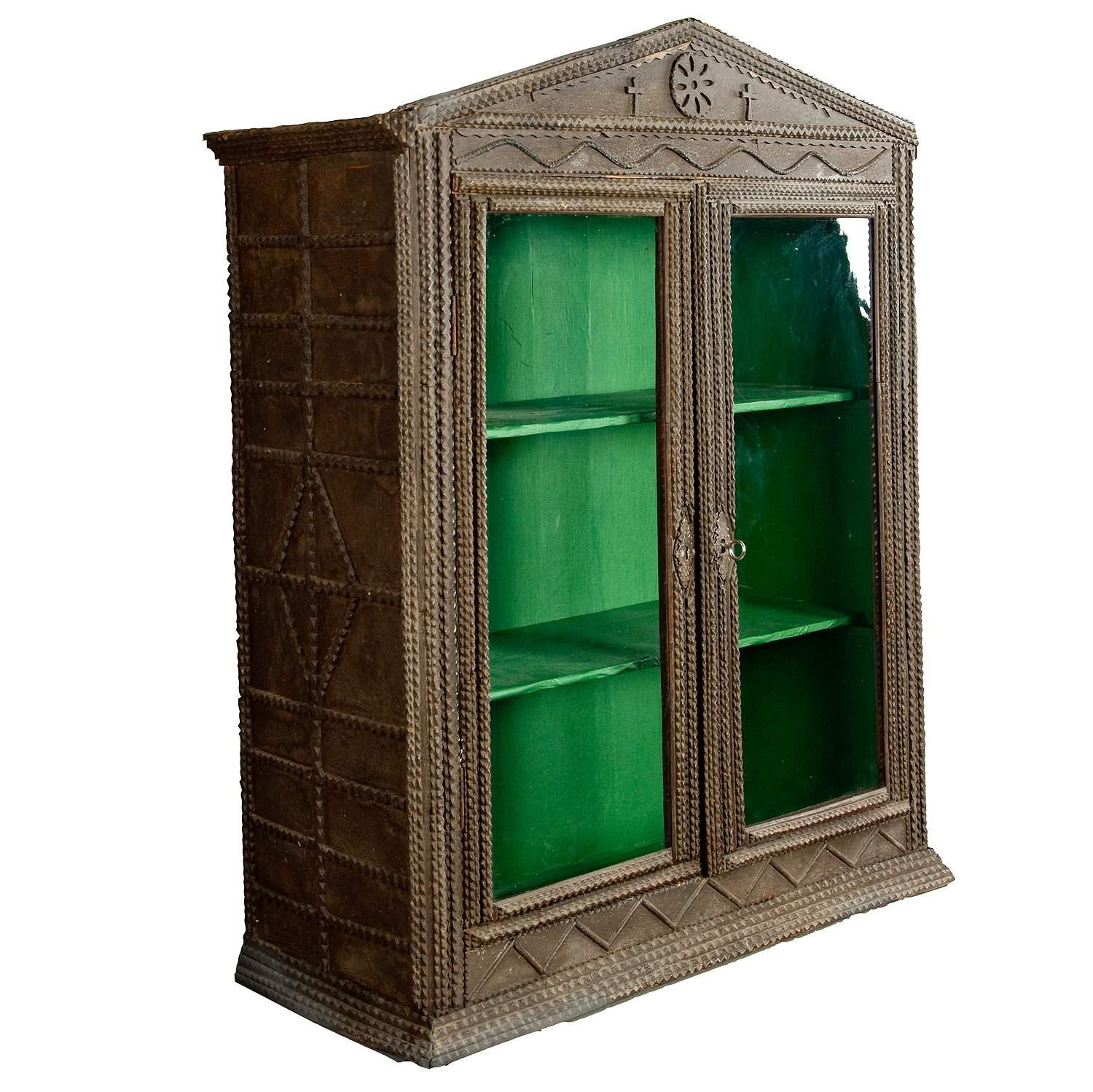 Antique Tramp Art Cabinet ca. 1900

The wooden tramp art cabinet is decorated with rich notch carvings. The inside is coated with green paper. It was executed in Germany ca. 1900.

Measures:
Width: 31.5